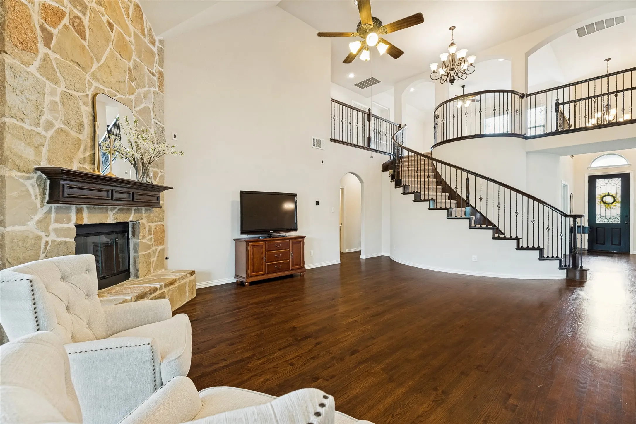 Front Large Dining area featuring wood-finish flooring, two large windows, and a tray ceiling