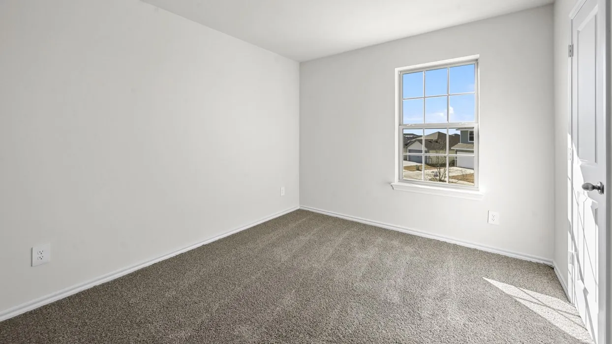 Room featuring light gray carpeting, neutral painted walls, and white baseboards