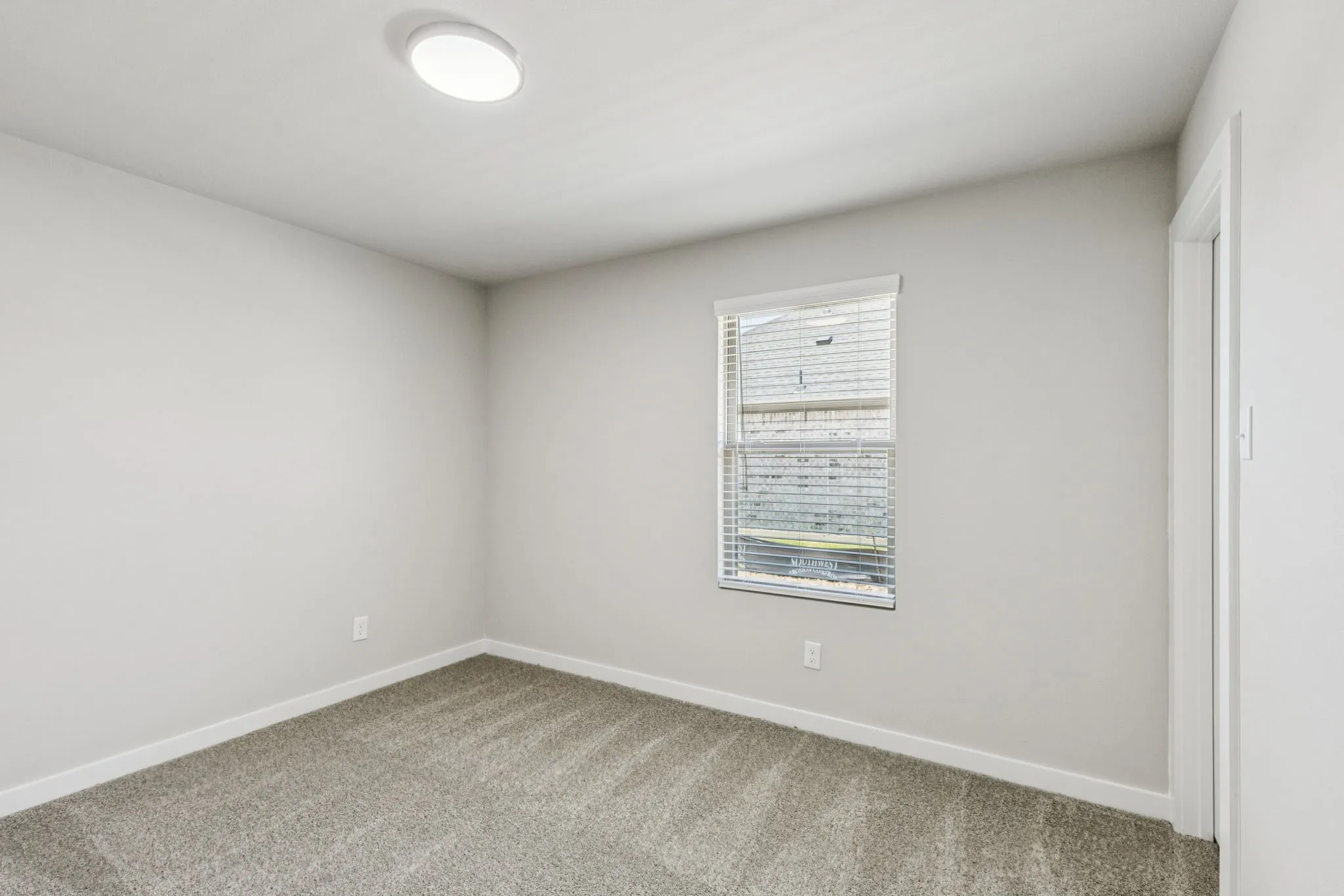 Bedroom in the Harper home plan by Trophy Signature Homes – REPRESENTATIVE PHOTO