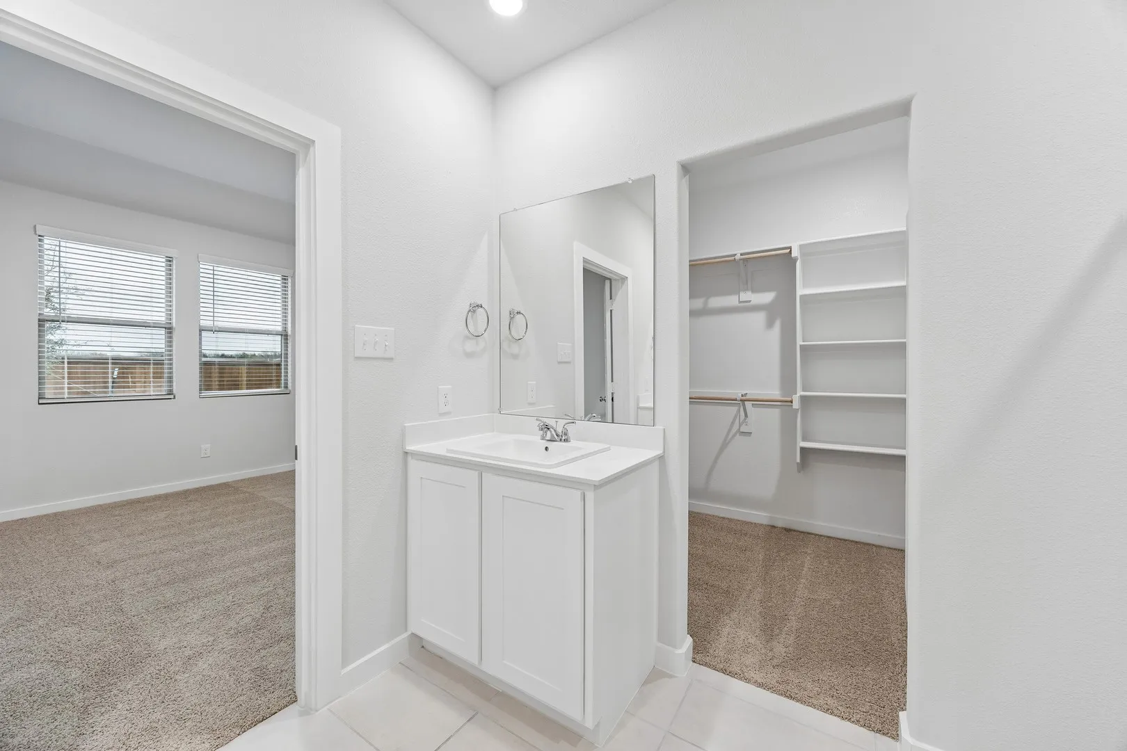 Primary Bathroom in the Cedar home plan by Trophy Signature Homes – REPRESENTATIVE PHOTO