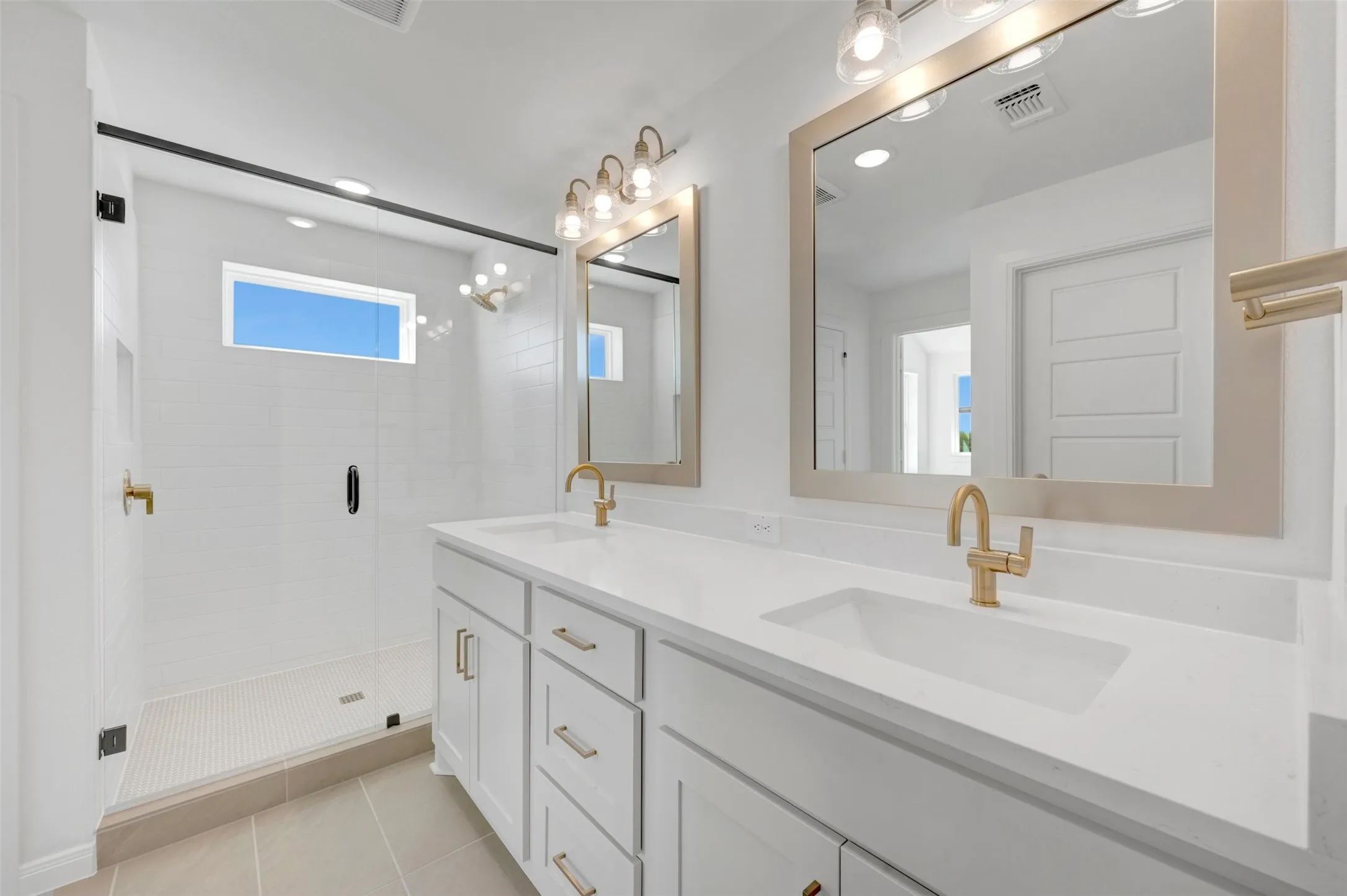 Dual vanity with integrated sinks and gold-tone fixtures