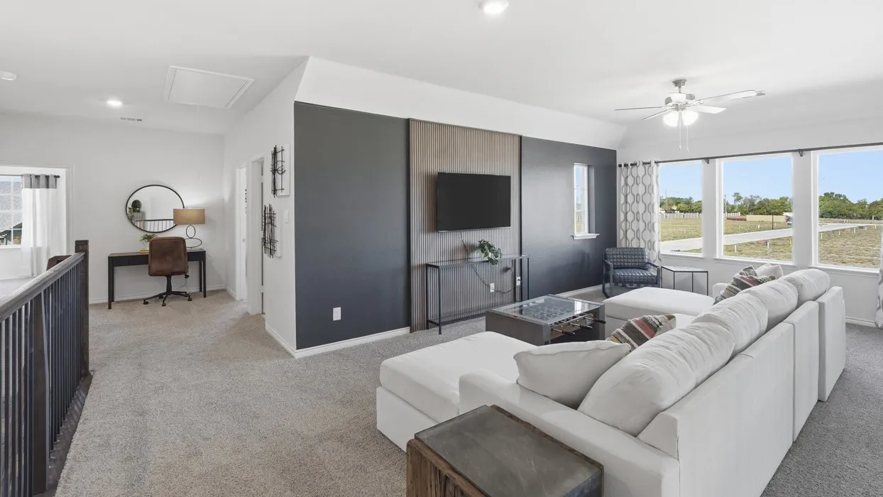 Carpeted loft area featuring a dedicated desk space, recessed lighting, and a ceiling fan