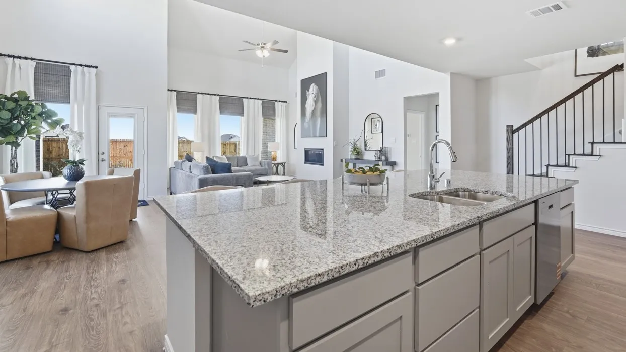Kitchen island with granite countertop and stainless steel sink
