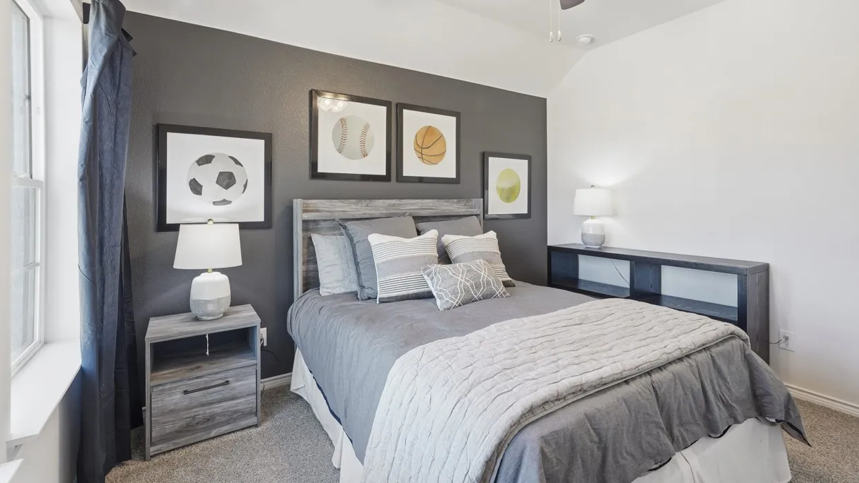 Bedroom featuring a vaulted ceiling and a ceiling fan