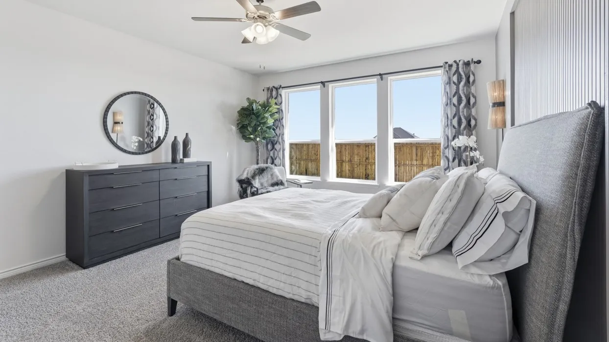 Plush carpet flooring complements white walls and multiple​​‌​​​​‌​​‌‌​‌‌​​​‌‌​‌​‌​‌​​​‌​​ windows
