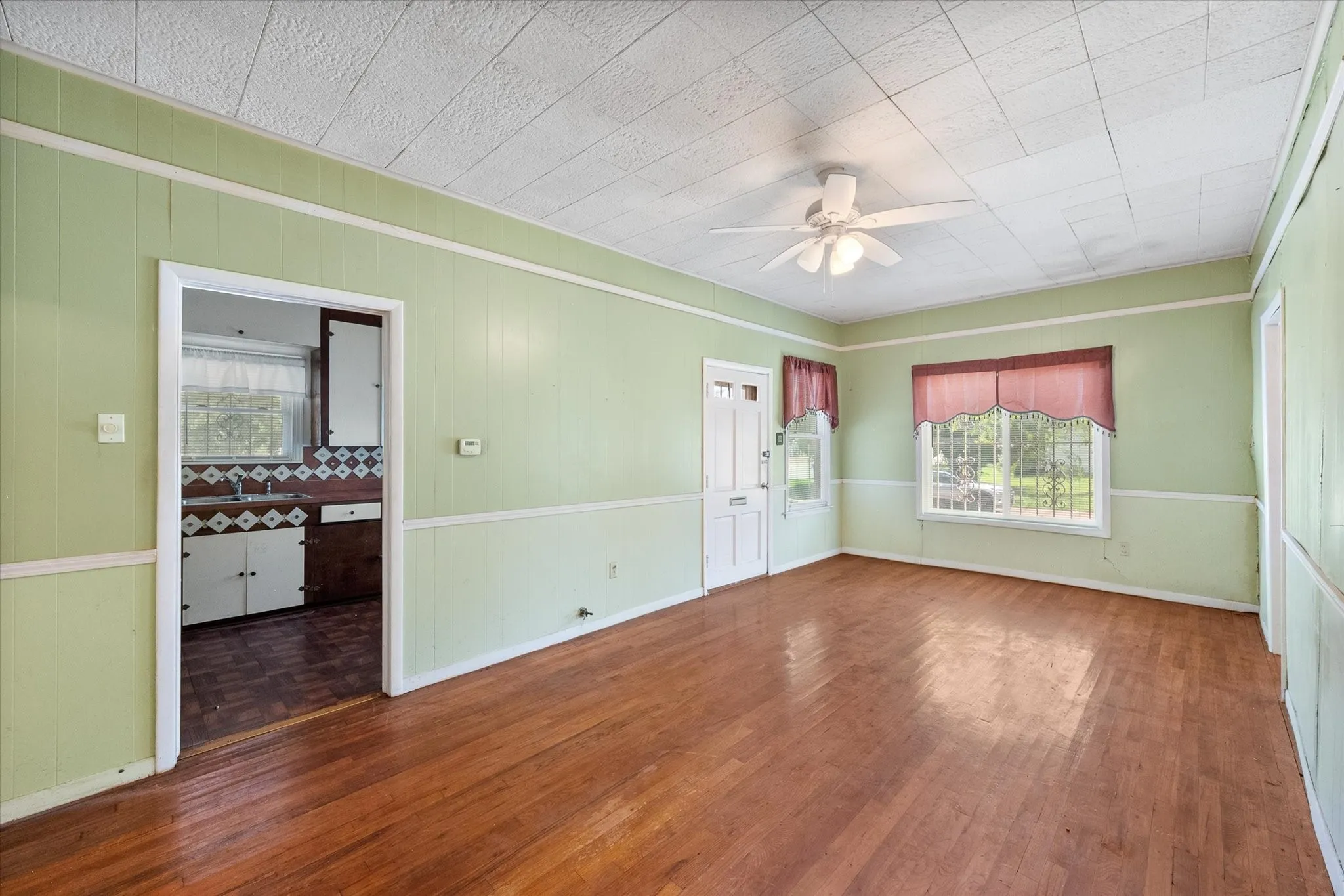 This generous living space connects easily to the kitchen and additional rooms throughout the flexible floor plan.