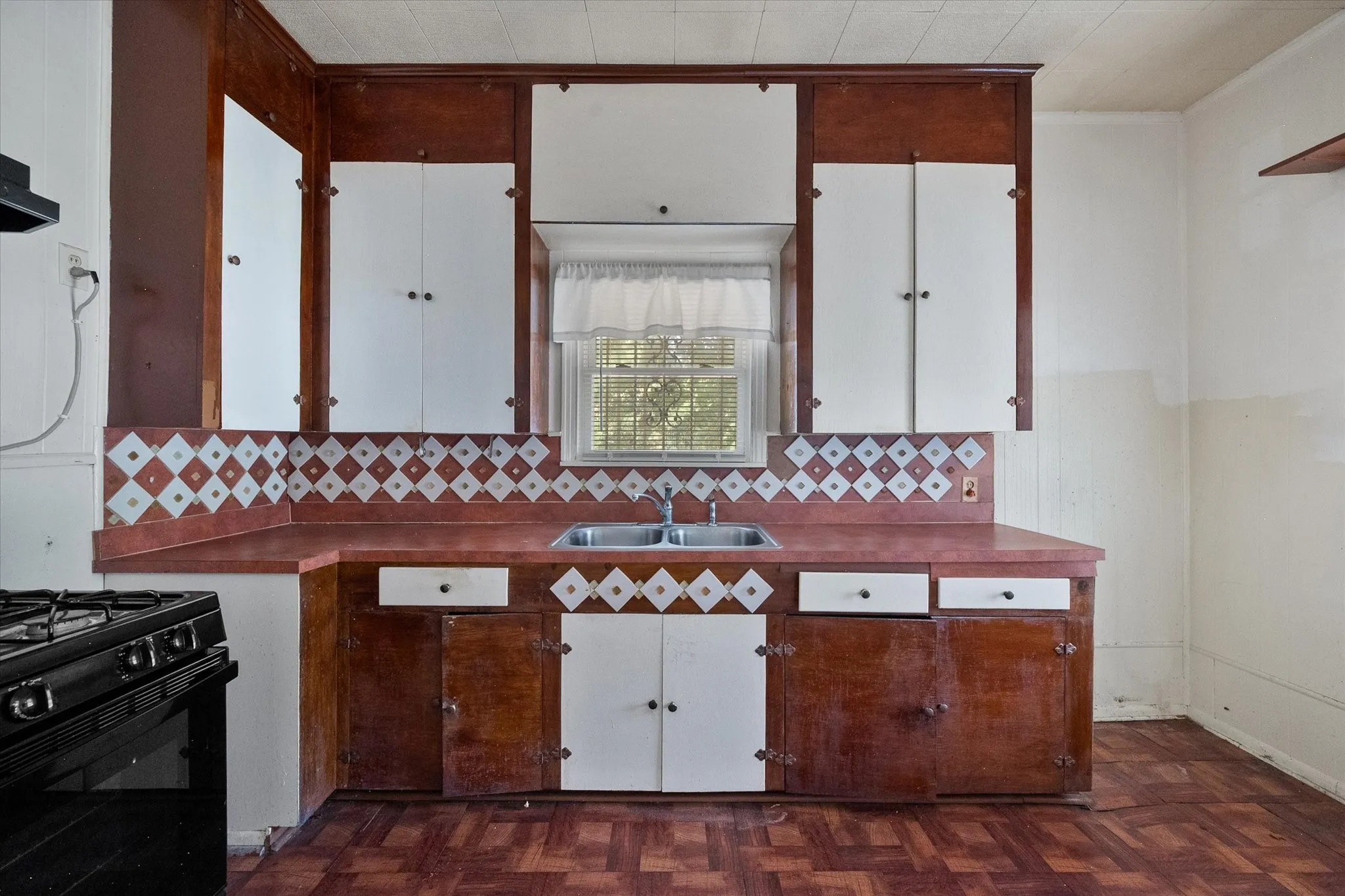 Extensive upper and lower cabinetry adds useful kitchen storage within this flexible Corsicana residence.