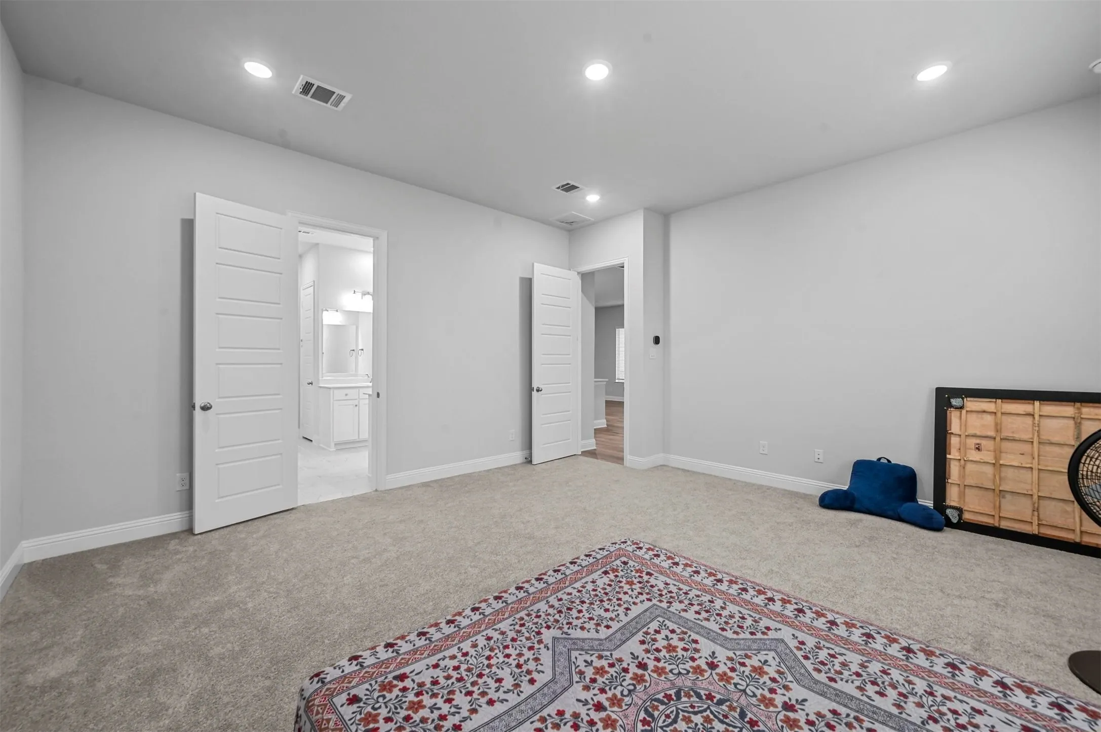Second primary bedroom featuring carpet, recessed lighting, and ensuite bathroom