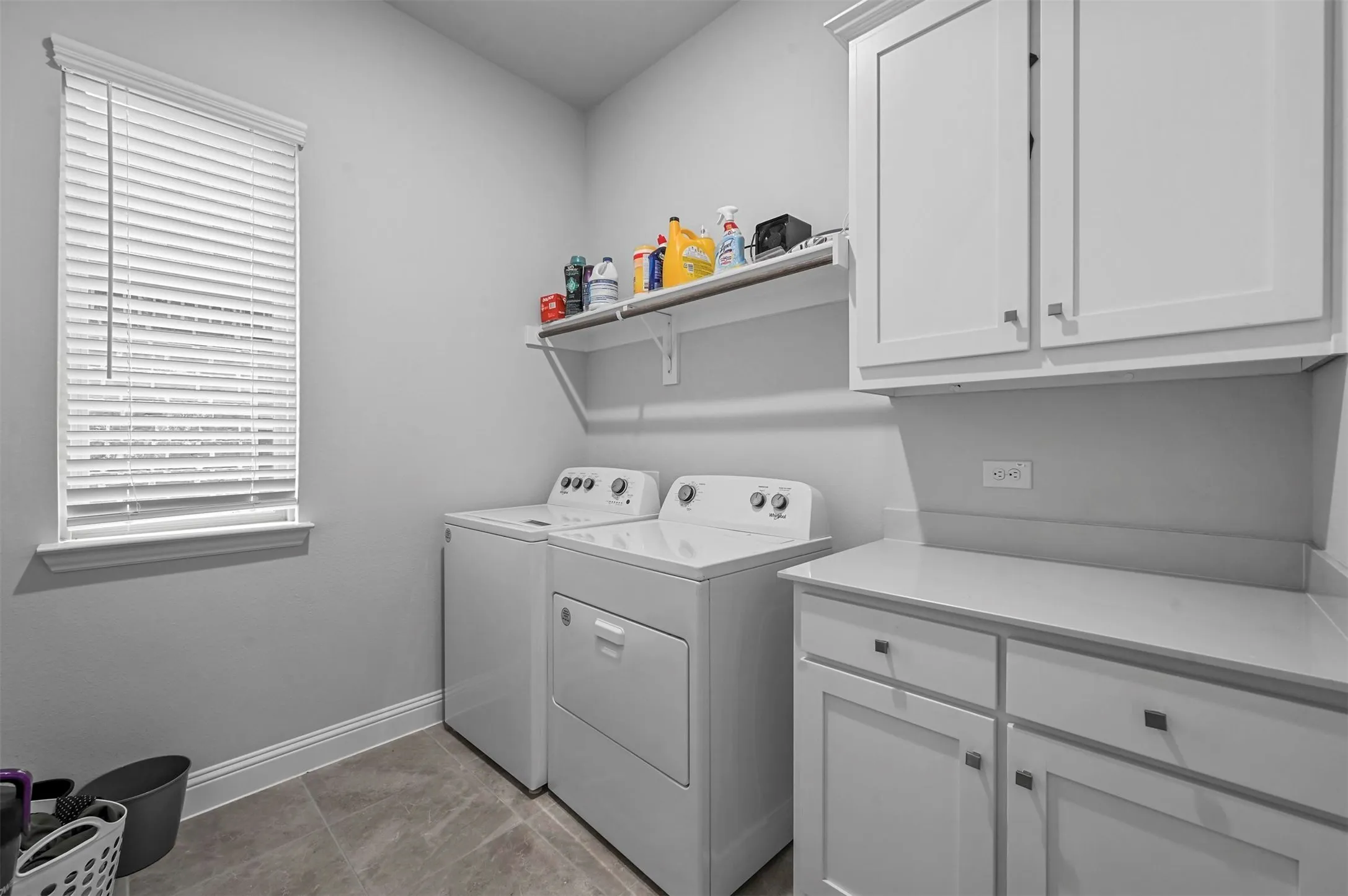 Laundry room with cabinets counter space for folding clothes. Washer and Dryer included with a good offer