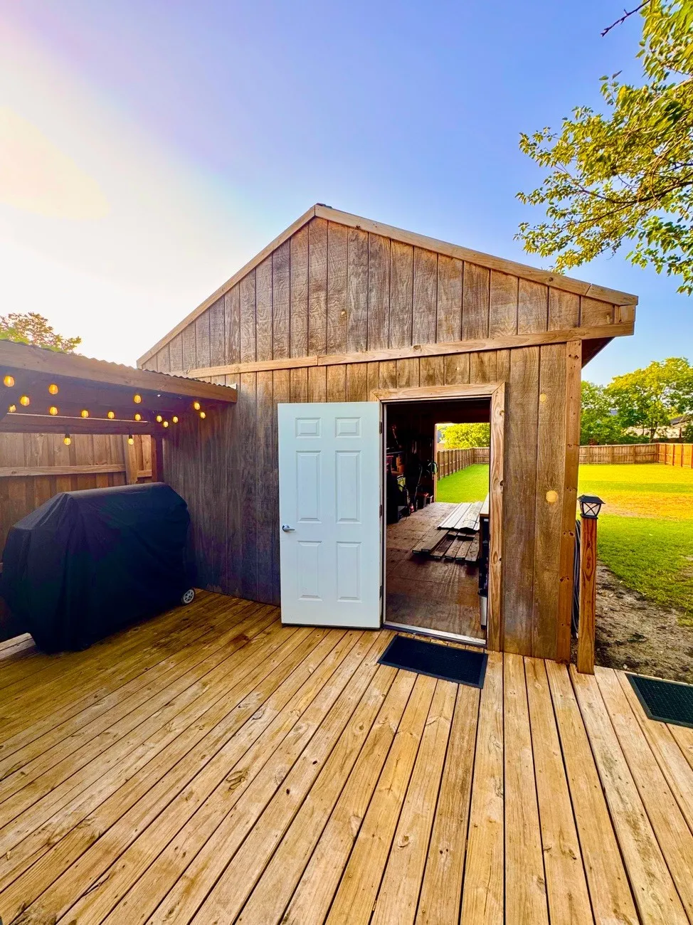 Wood-finish deck with a rustic-style shed