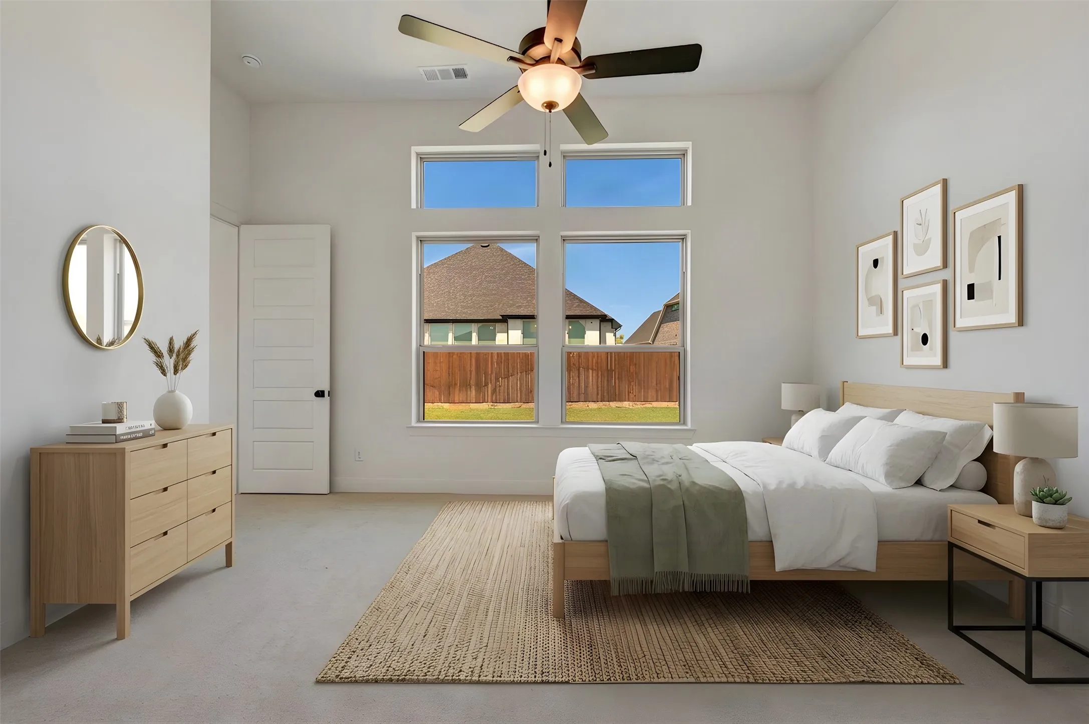 High ceilings with a ceiling fan, multiple windows, and light-toned walls