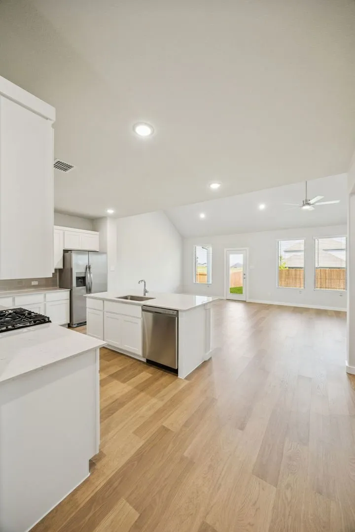 Open First Floor in the Masters home plan by Trophy Signature Homes – REPRESENTATIVE PHOTO