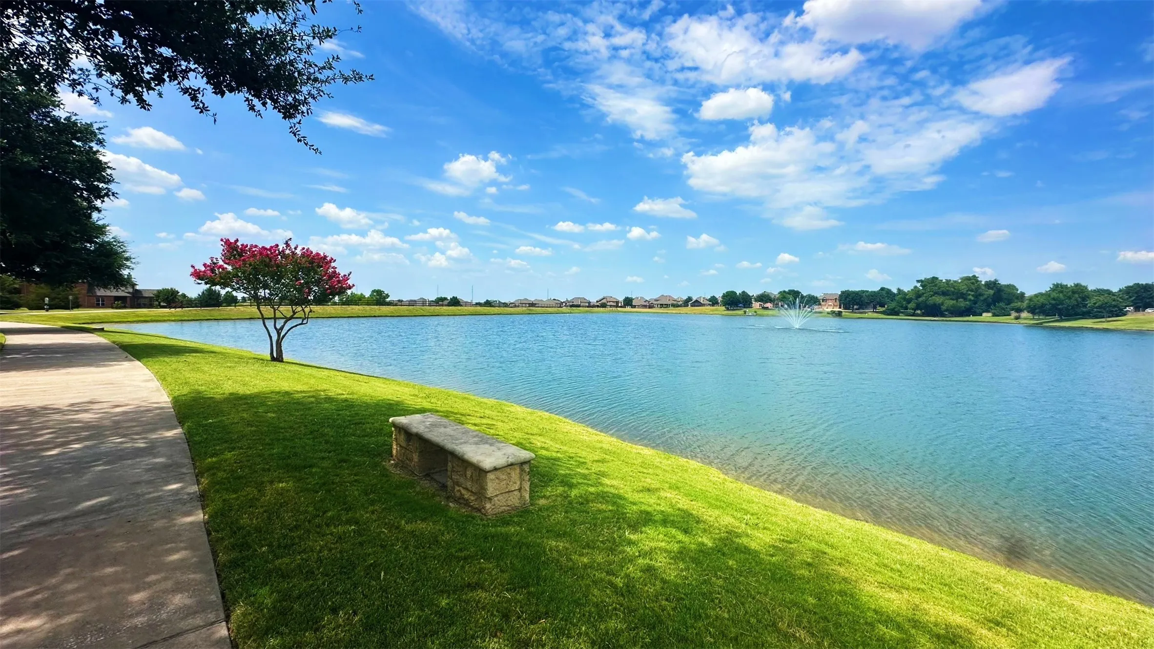 The 10-acre scenic community lake located in Carter Ranch at 414 Dartmoor Dr in Celina, Texas. This resident-only amenity features a dedicated catch-and-release fishing pier, surrounding greenbelt views, and paved walking trails throughout the neighborhood.