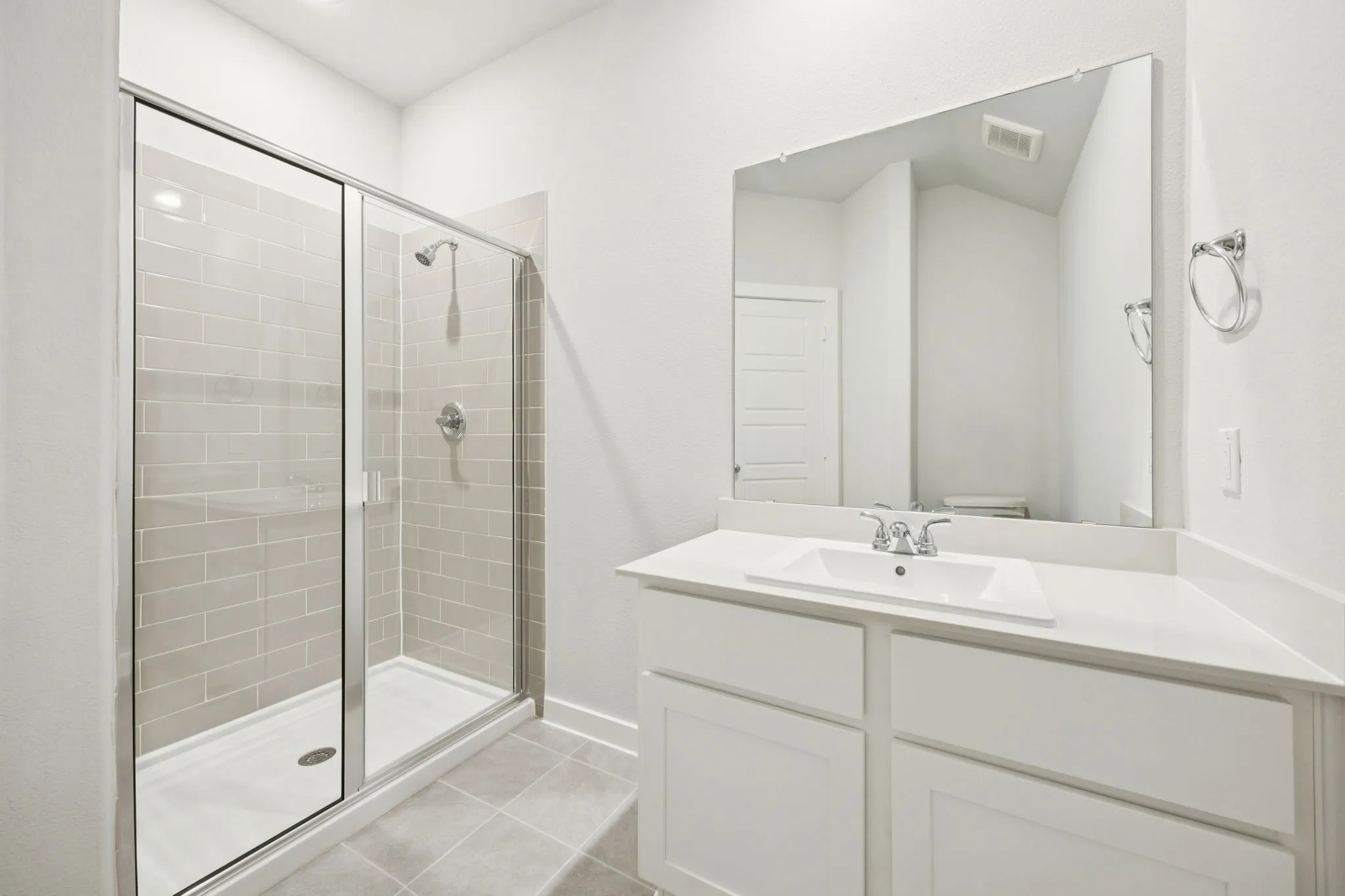 Bathroom in the Masters home plan by Trophy Signature Homes – REPRESENTATIVE PHOTO