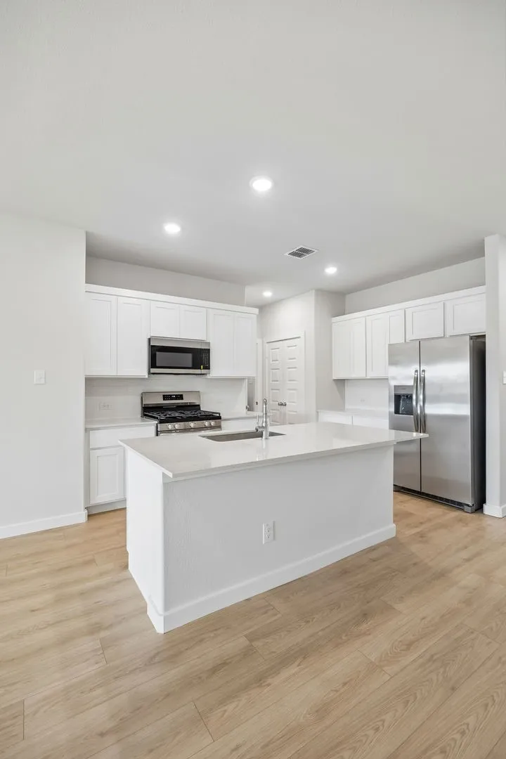 Kitchen in the Mesquite home plan by Trophy Signature Homes – REPRESENTATIVE PHOTO