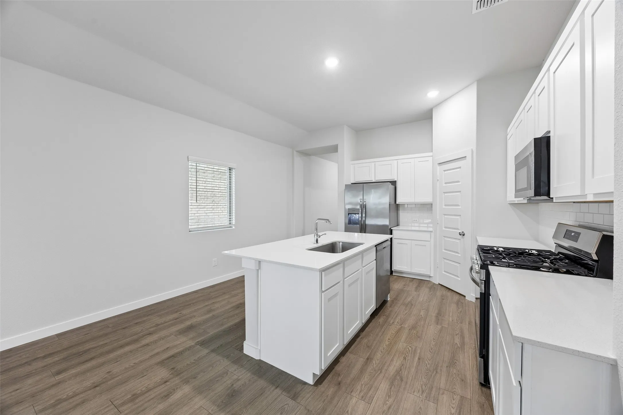 Kitchen in the Cedar home plan by Trophy Signature Homes – REPRESENTATIVE PHOTO