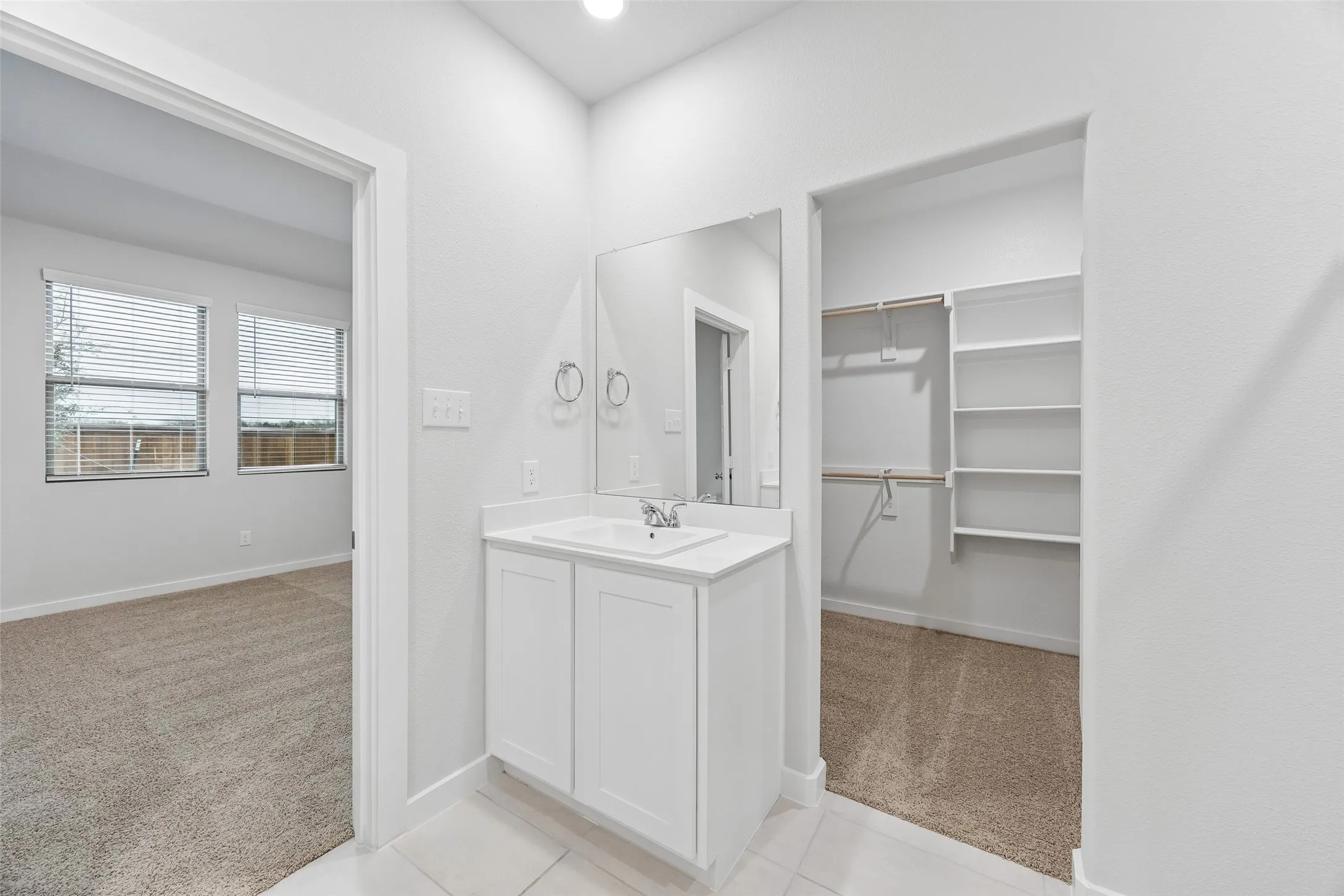 Primary Bathroom in the Cedar home plan by Trophy Signature Homes – REPRESENTATIVE PHOTO