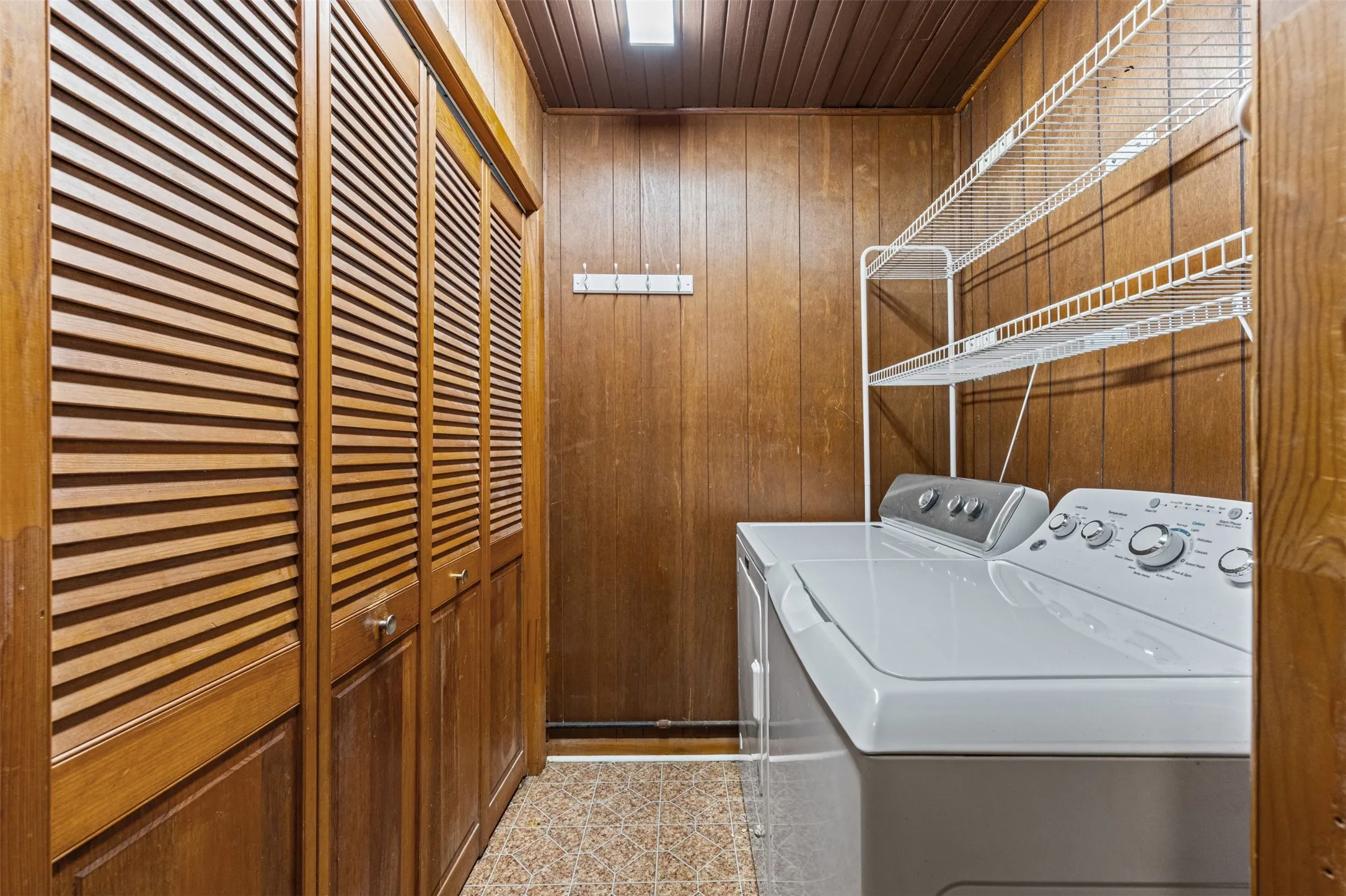 Wall to wall closet in laundry room