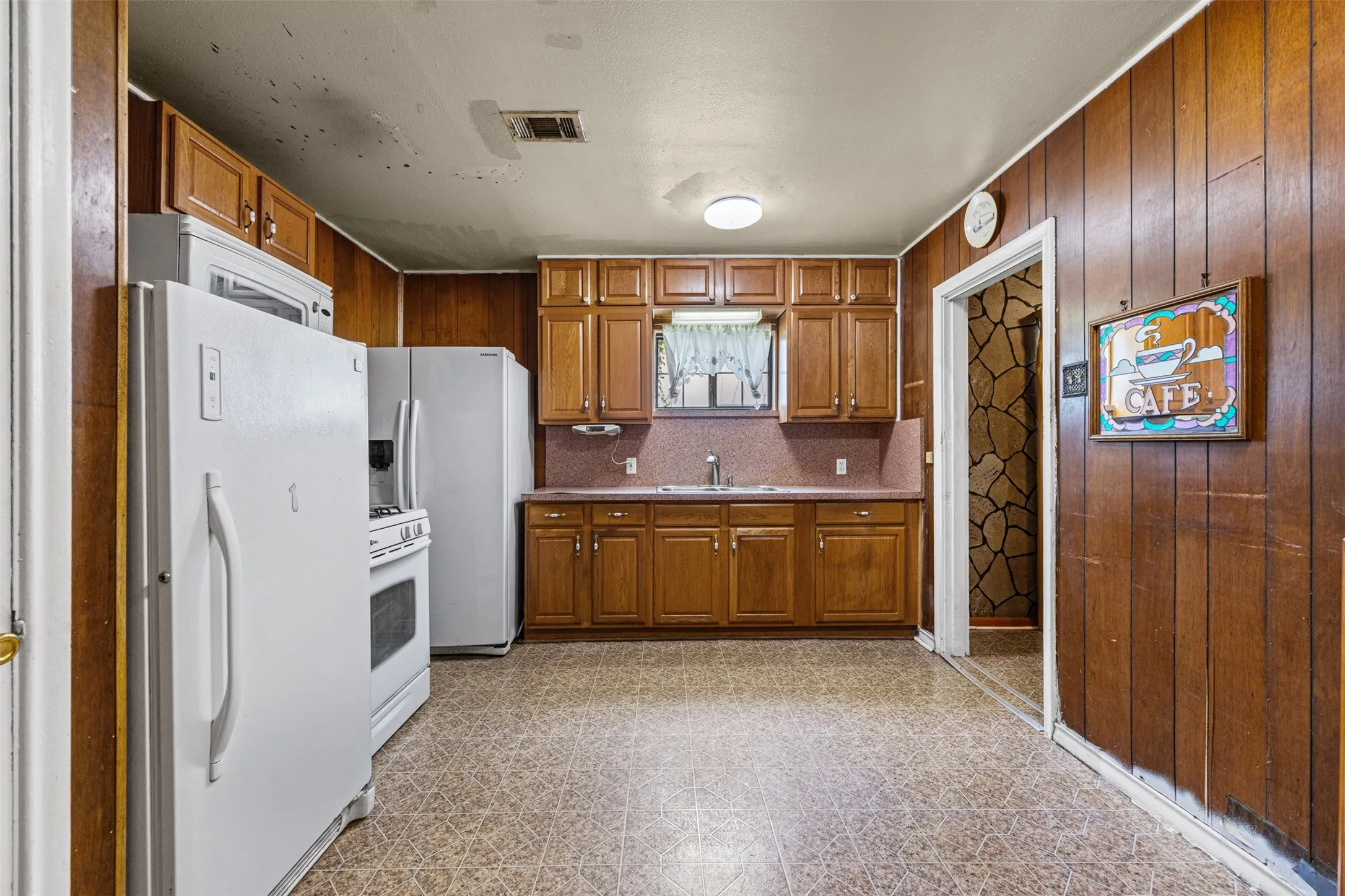 Large kitchen has space for a small eating area