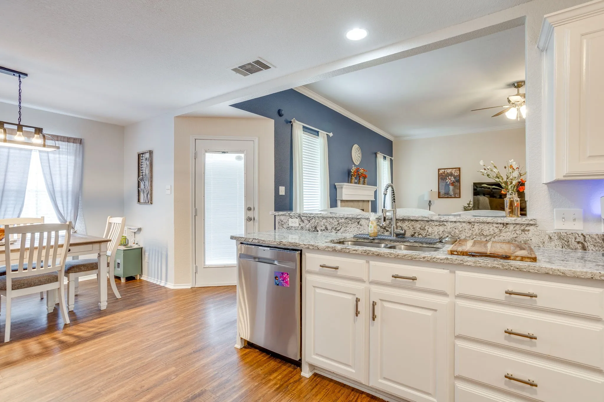 Kitchen featuring an open concept floorplan with flush recessed lighting, and single-basin under-mount sink.