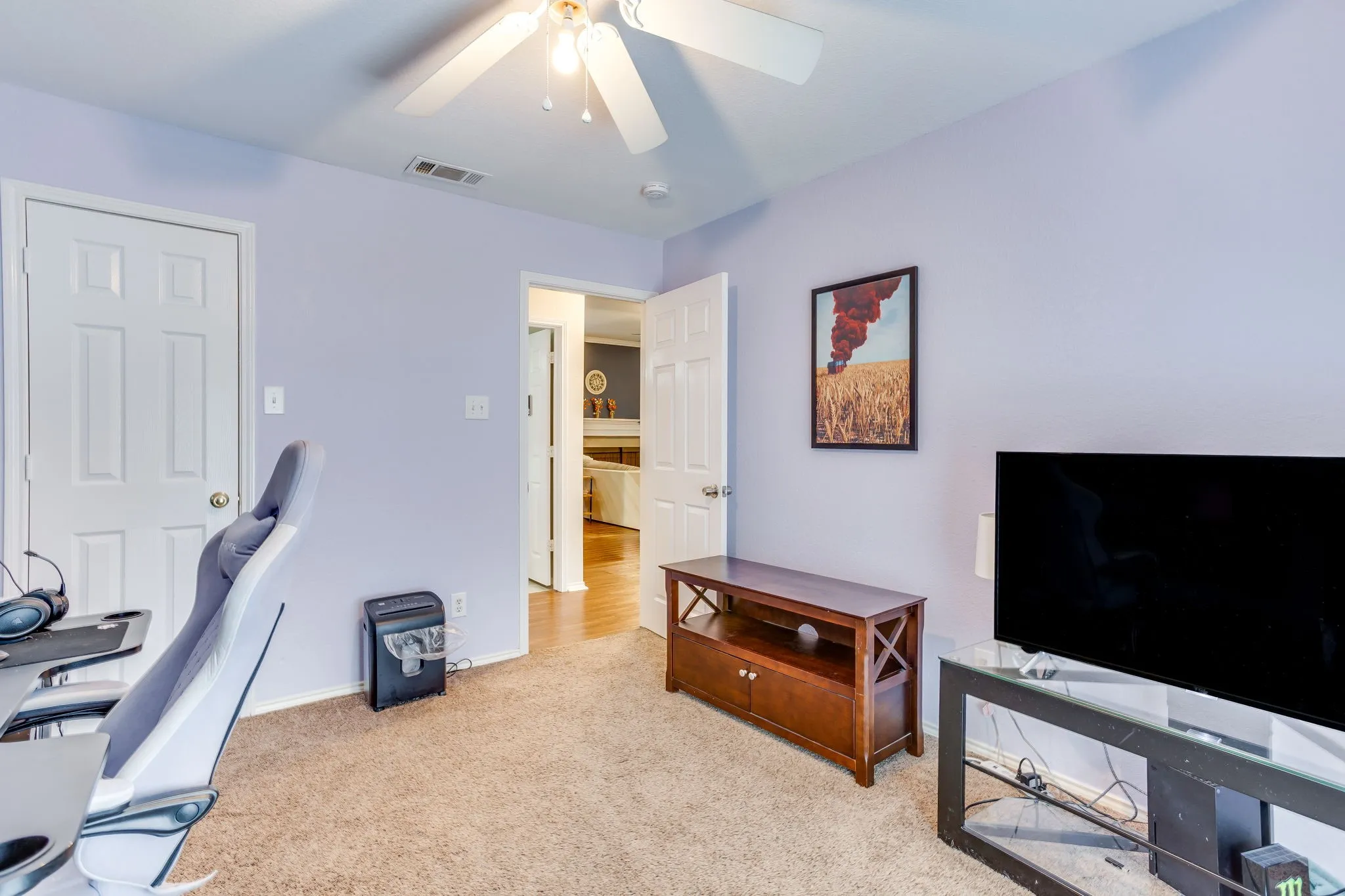 Bedroom featuring a closet allowing for room to be a multi-use space, white baseboards and classic 6 panel door.