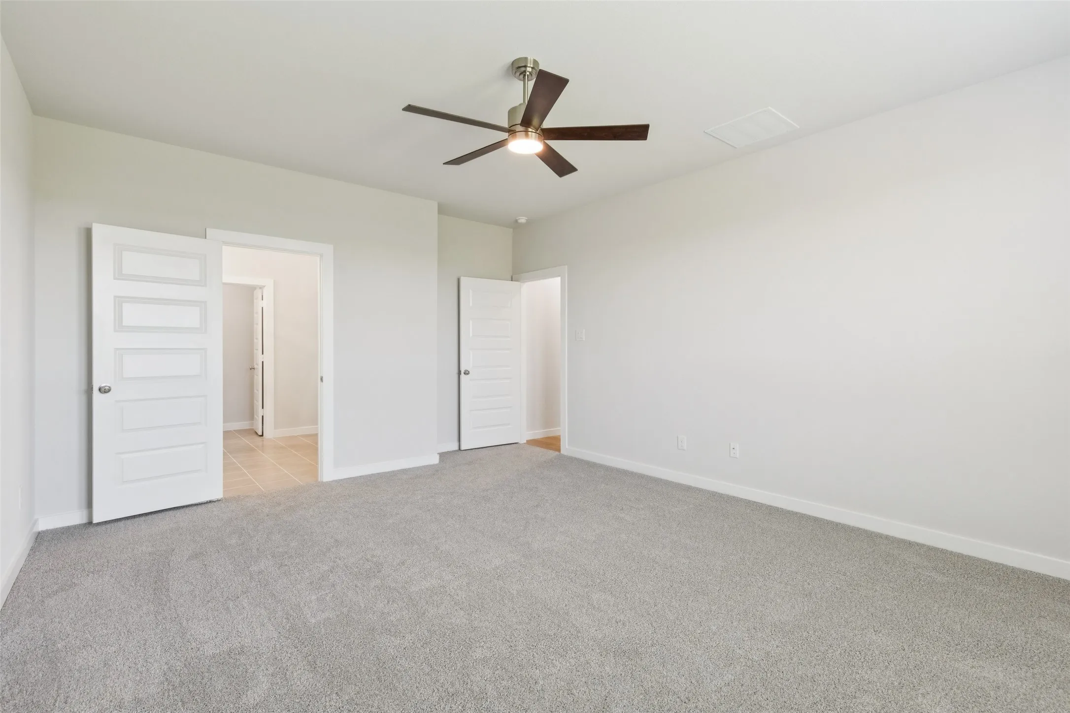 Primary Suite in the Masters home plan by Trophy Signature Homes – REPRESENTATIVE PHOTO