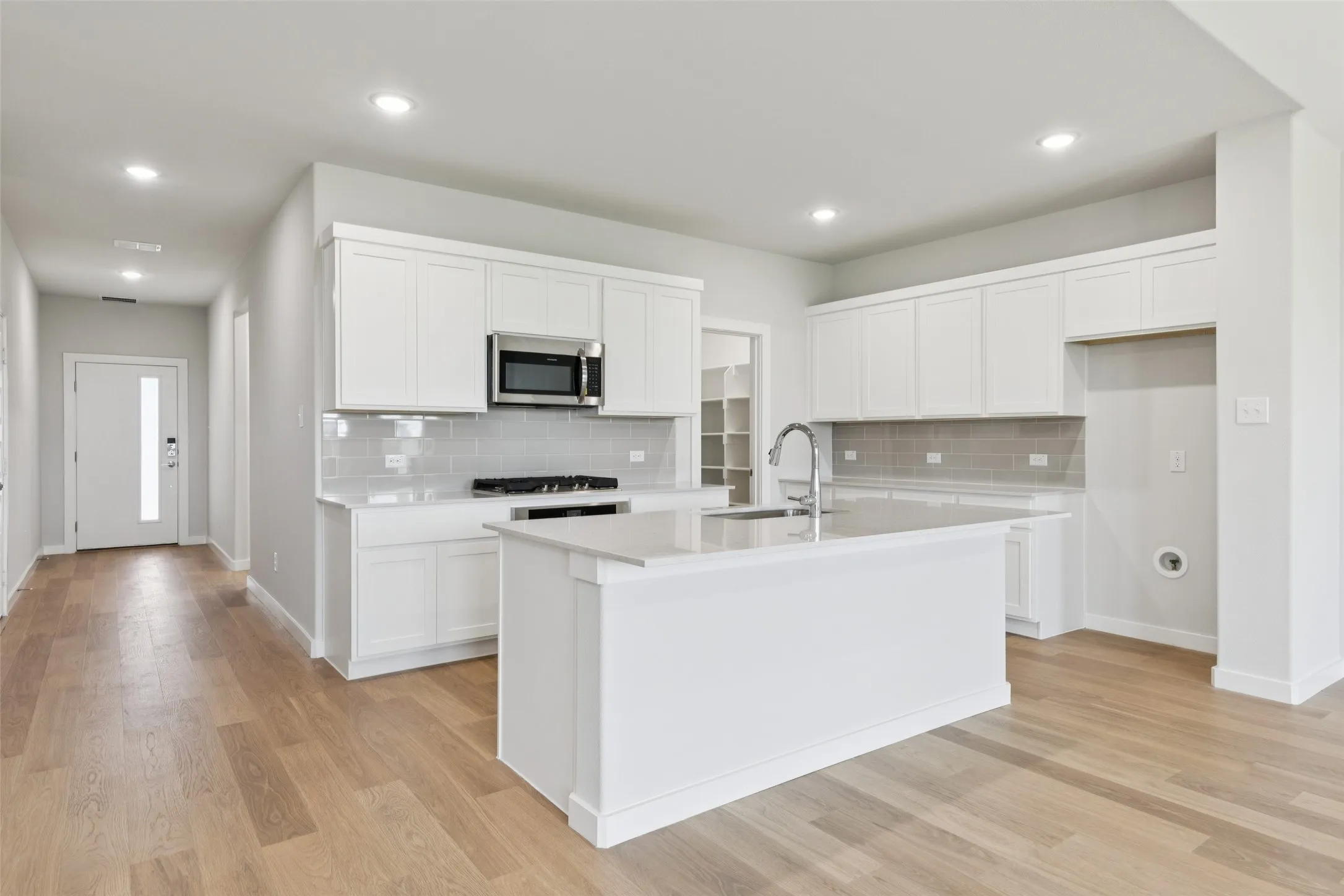 Kitchen in the Masters home plan by Trophy Signature Homes – REPRESENTATIVE PHOTO