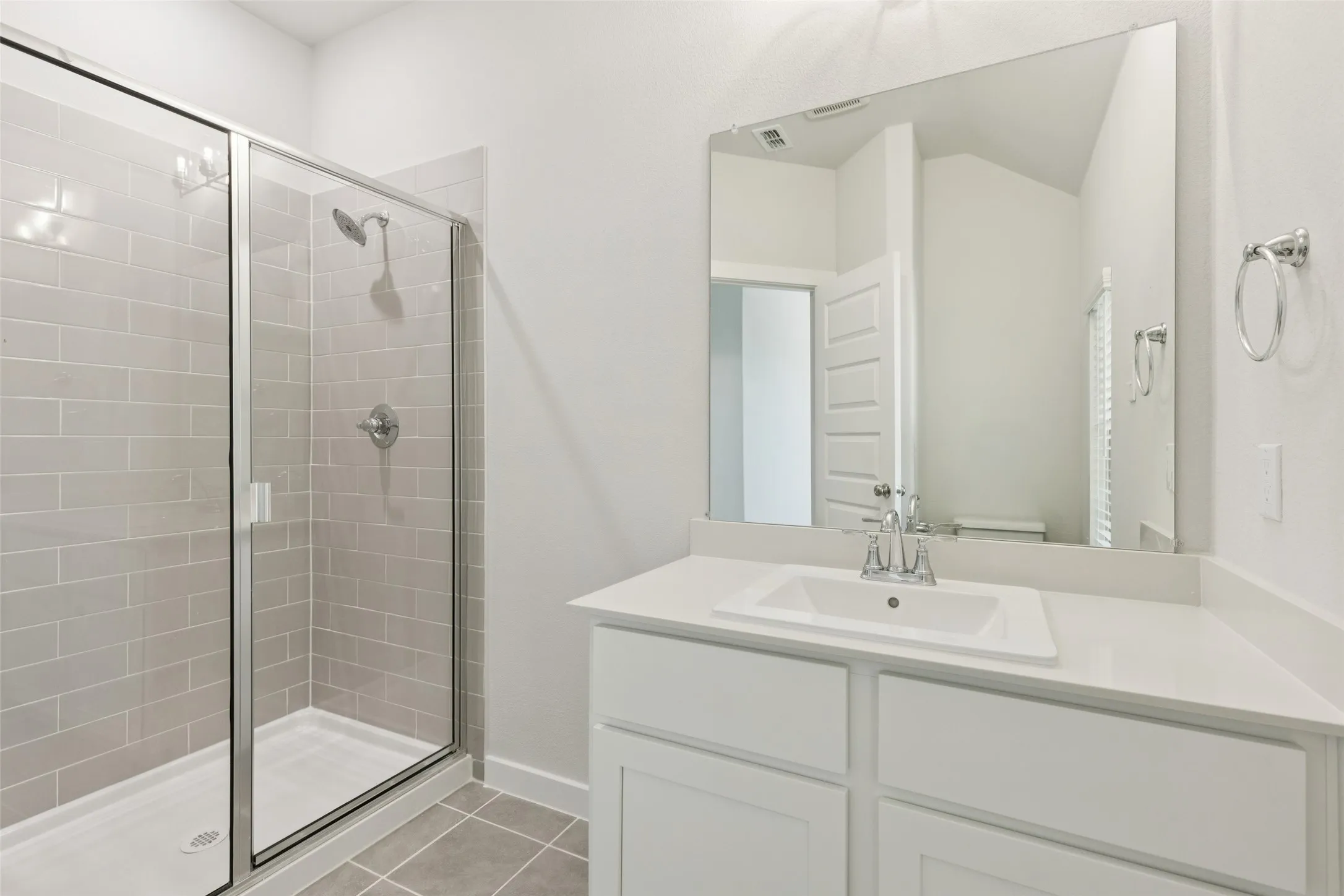 Primary Bathroom in the Masters home plan by Trophy Signature Homes – REPRESENTATIVE PHOTO