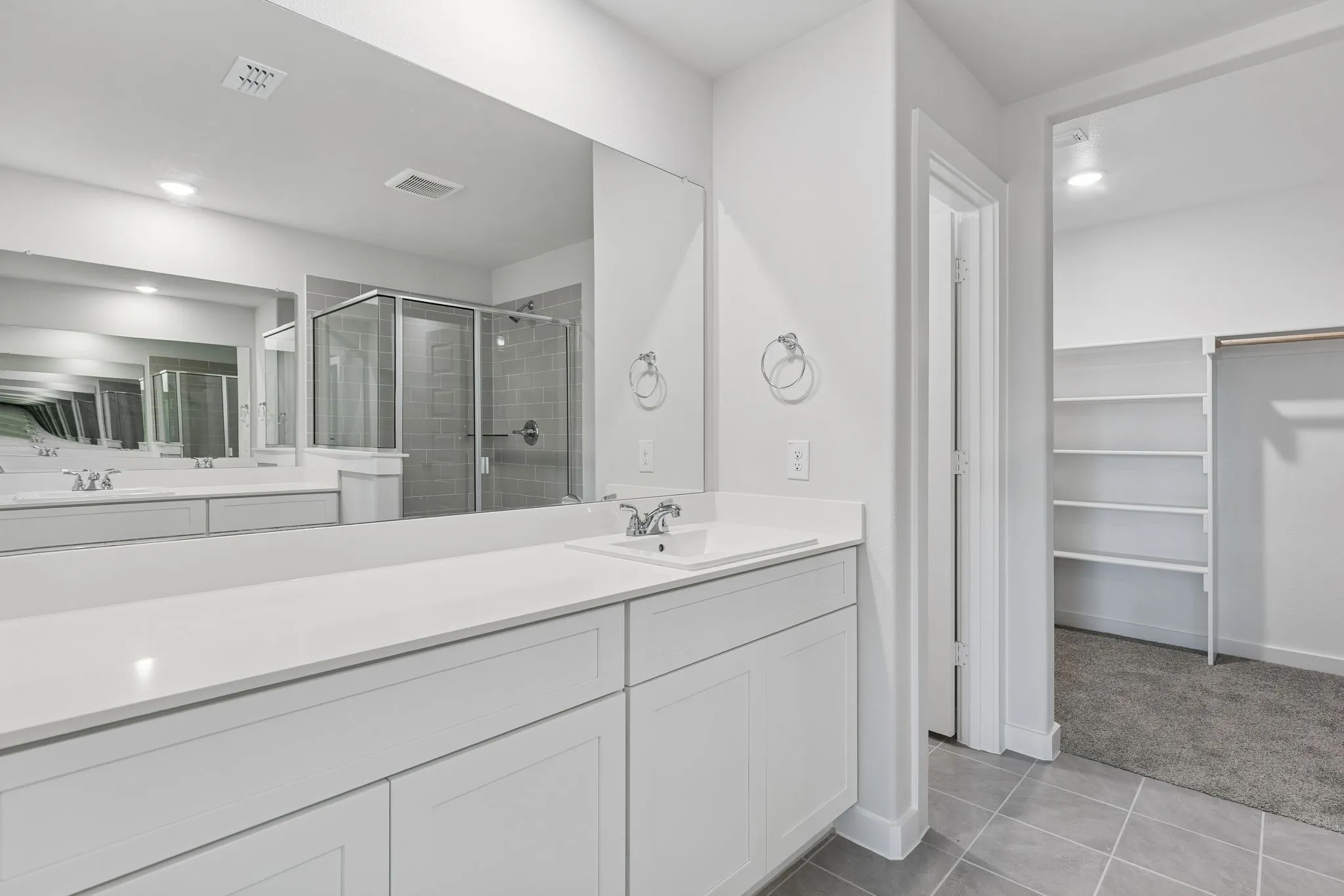 Primary Bathroom in the Harrison home plan by Trophy Signature Homes – REPRESENTATIVE PHOTO