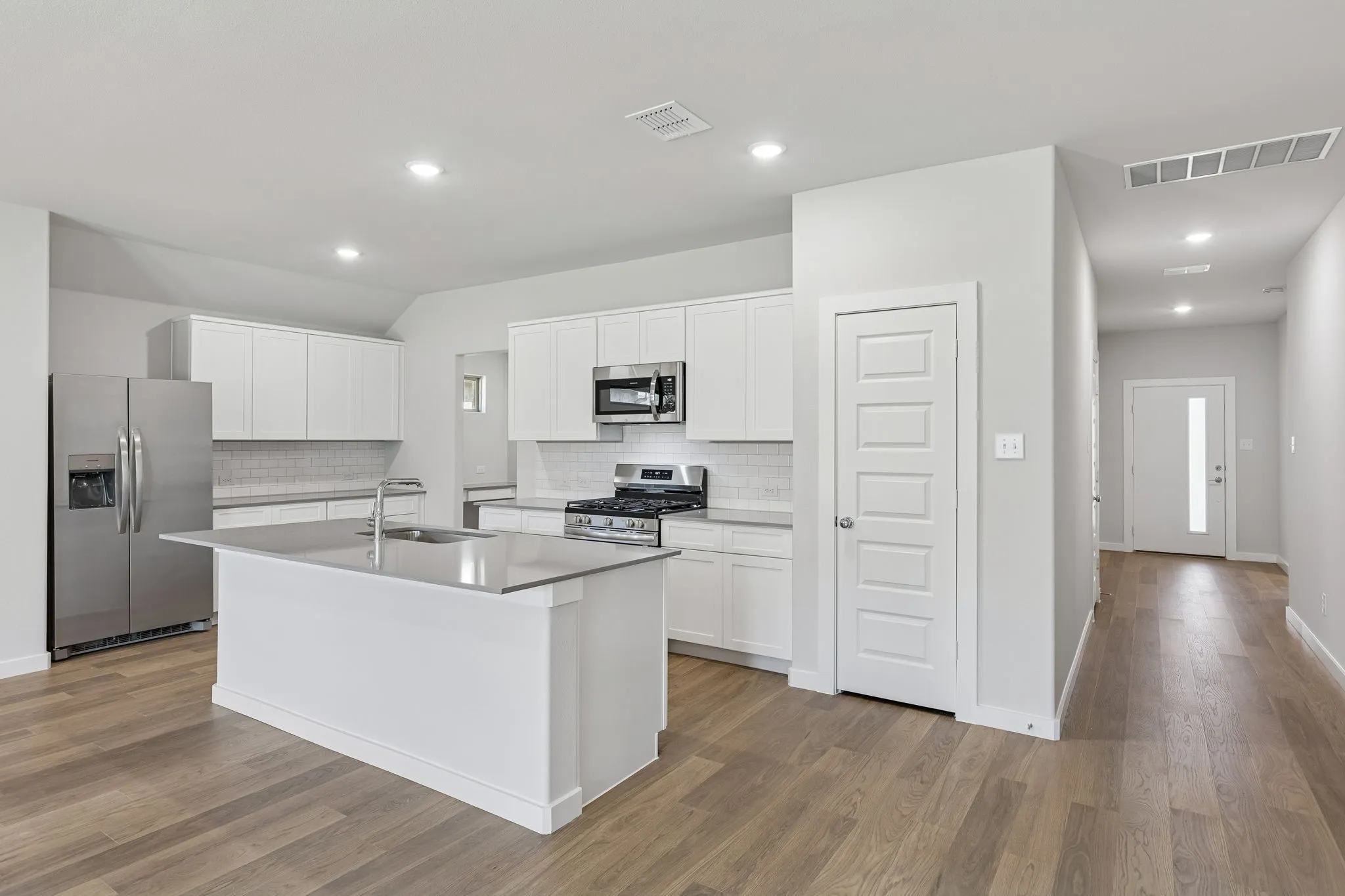 Kitchen in the Harrison home plan by Trophy Signature Homes – REPRESENTATIVE PHOTO