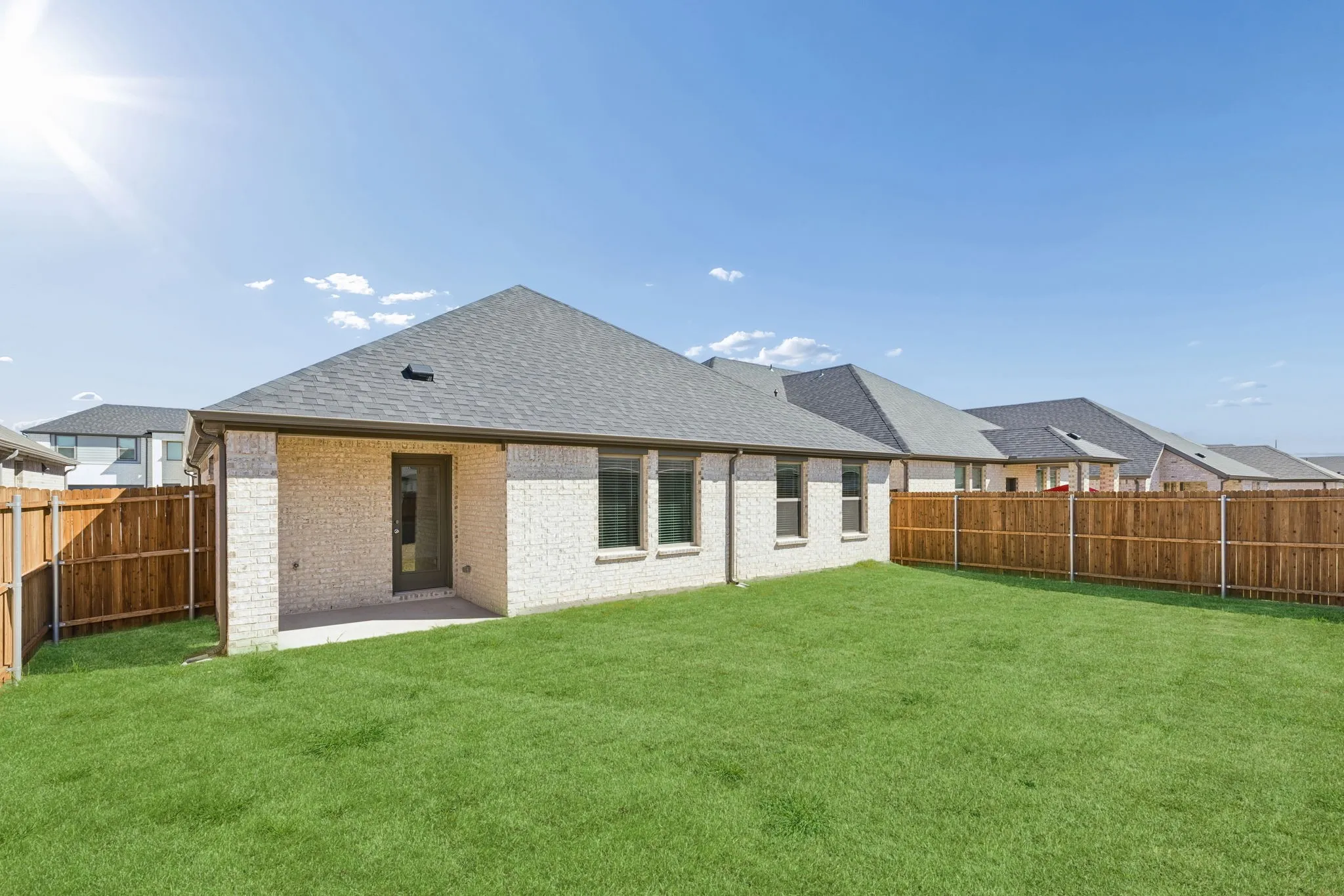 Covered Patio in the Harrison home plan by Trophy Signature Homes – REPRESENTATIVE PHOTO