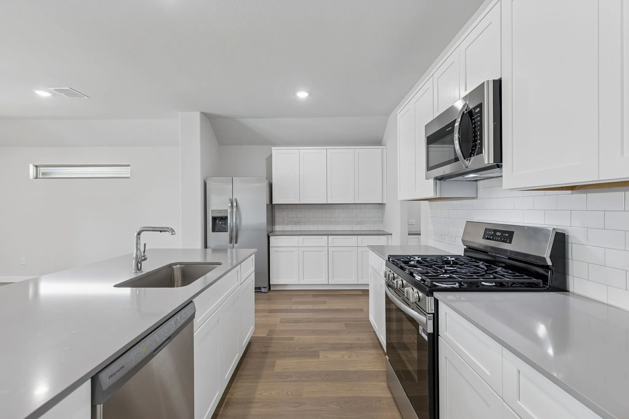 Kitchen in the Harrison home plan by Trophy Signature Homes – REPRESENTATIVE PHOTO