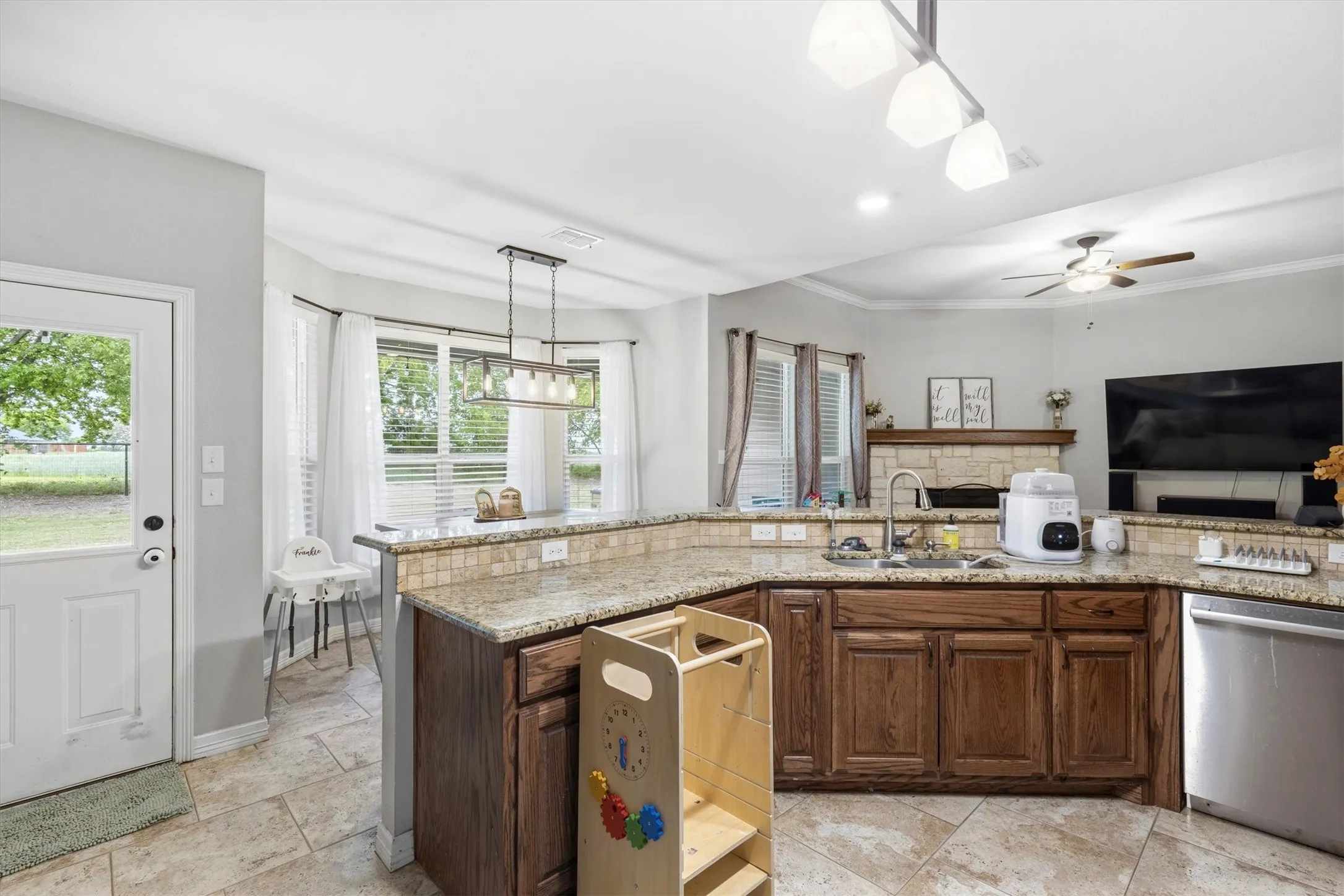 Kitchen with wood-finish cabinetry and granite countertops