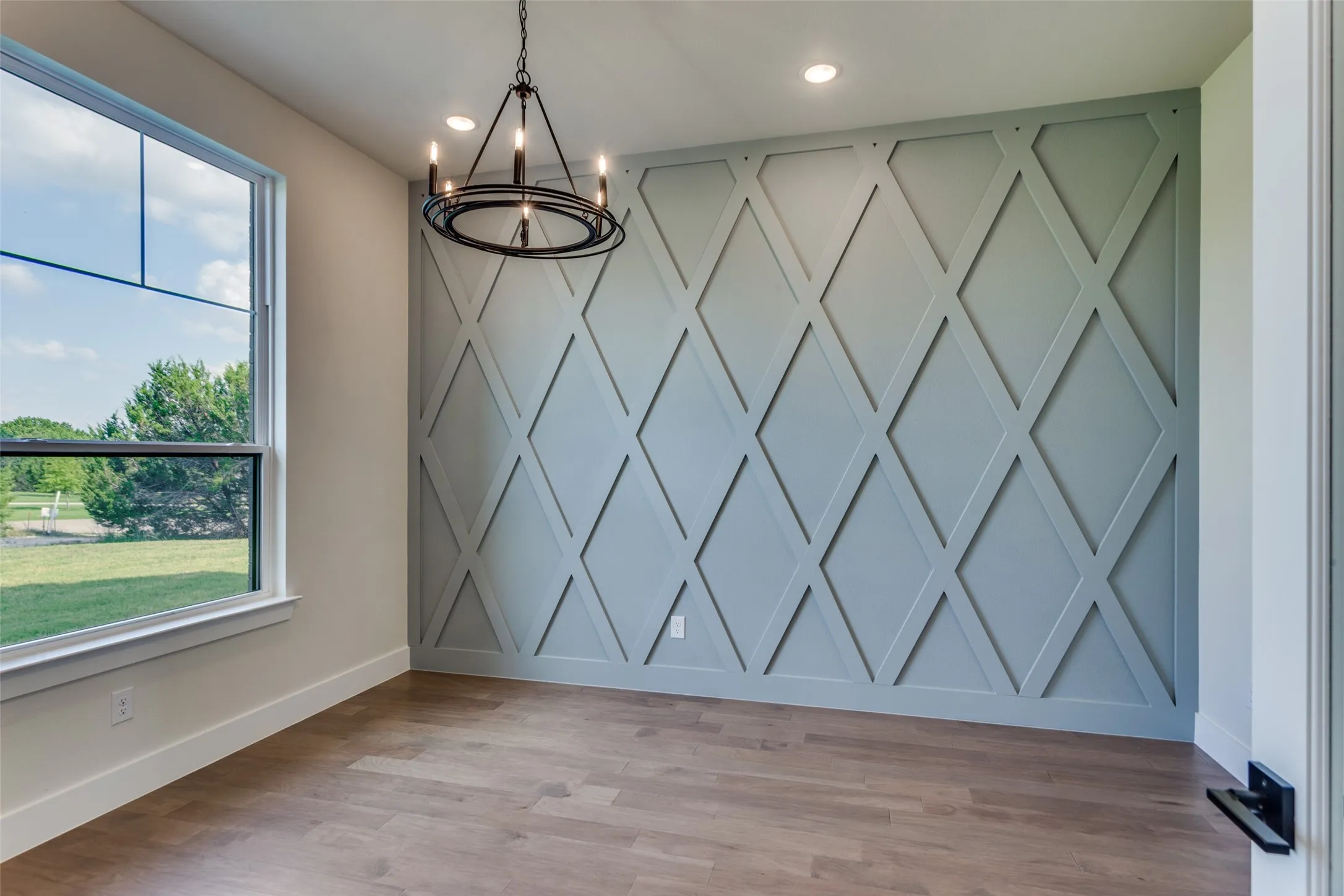 Office to the left upon Entry with Custom Designer Millwork Feature