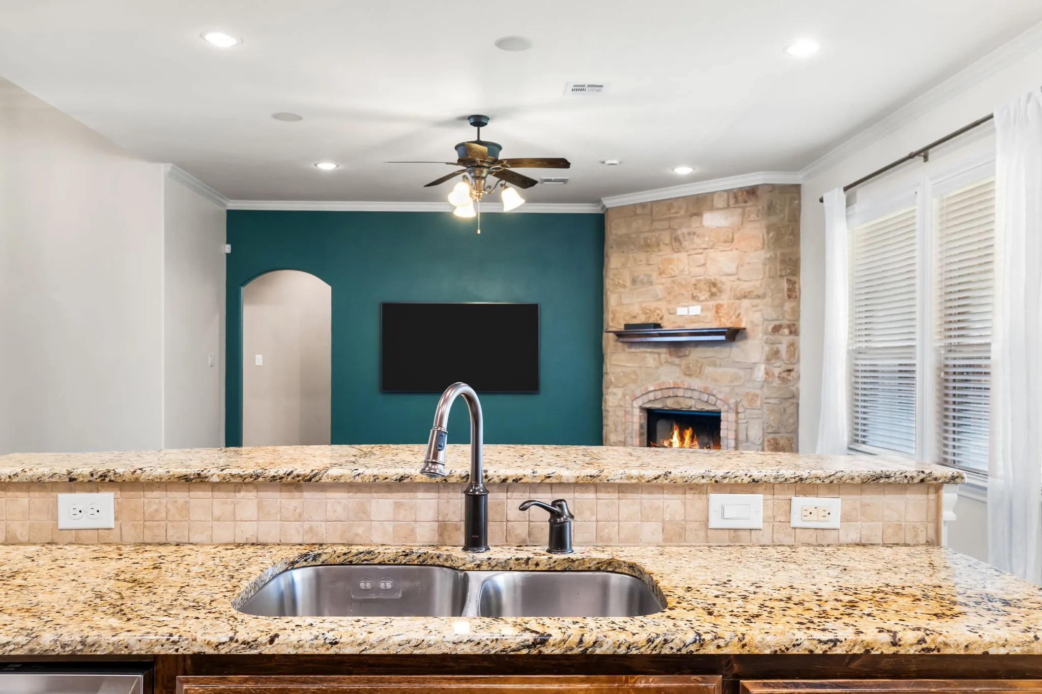 Kitchen island with granite countertop and double stainless steel sink