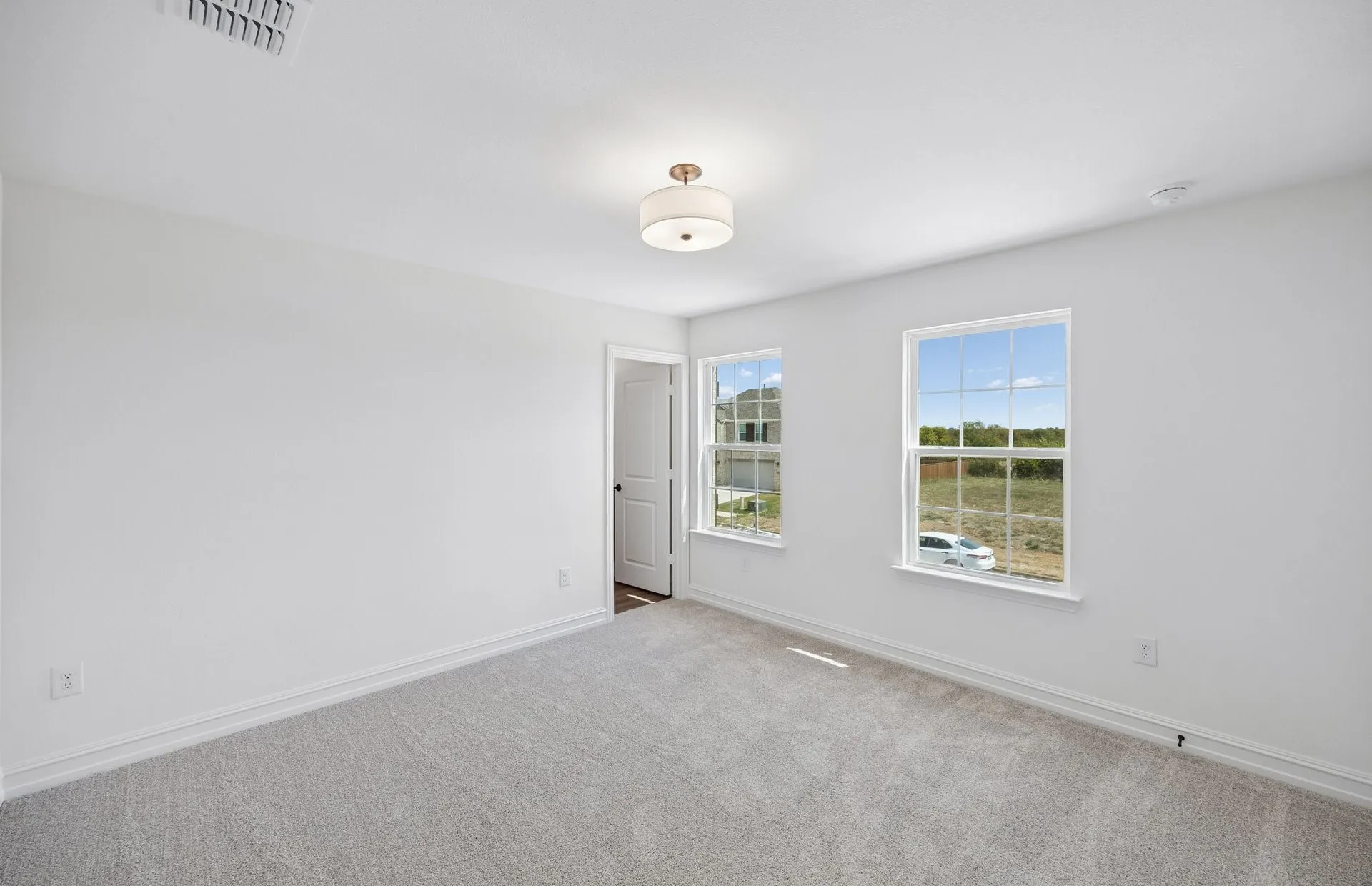 Secondary bedroom with large windows