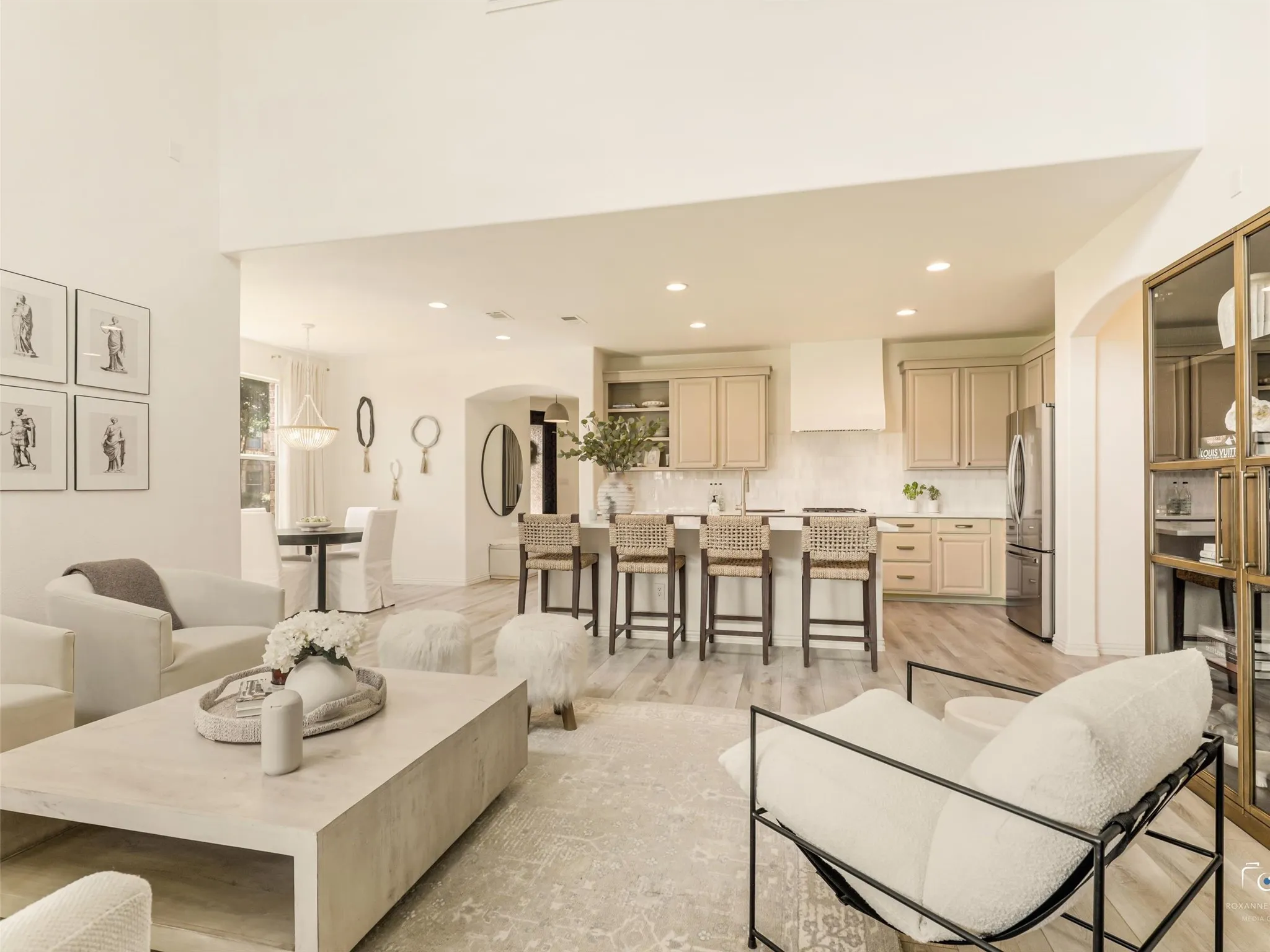 Open floor plan is ideal for entertaining, featuring soaring ceilings, expansive windows, and abundant natural light.