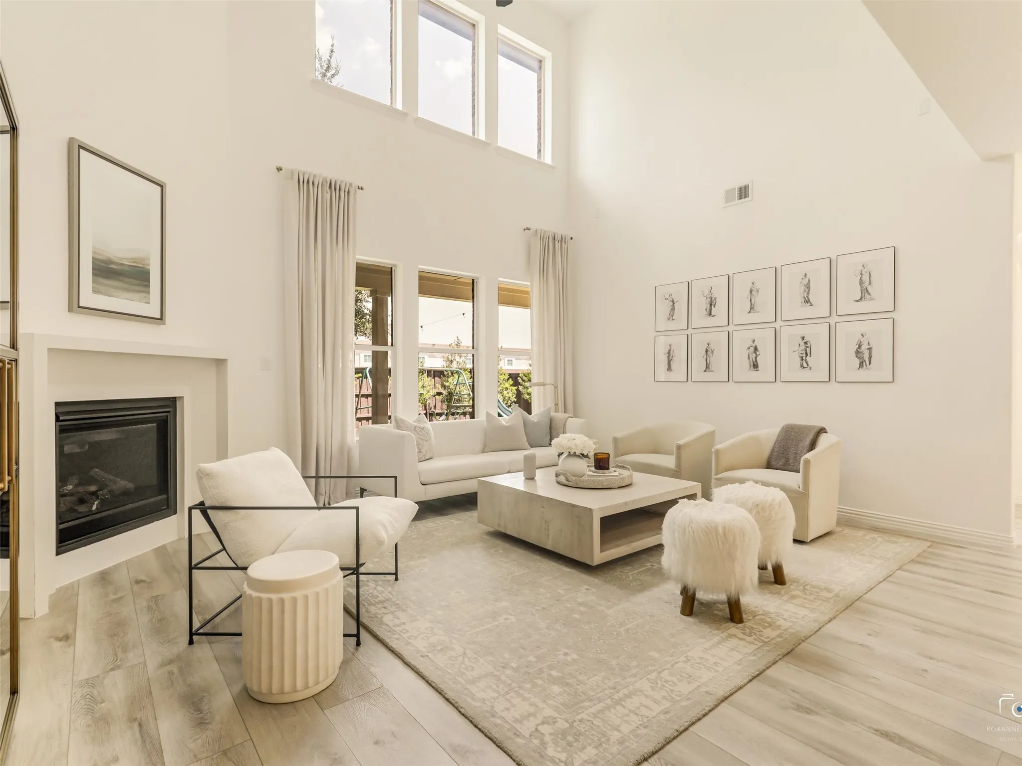 Beautiful and dramatic two-story living room, creating the perfect space for everyday living and entertaining.