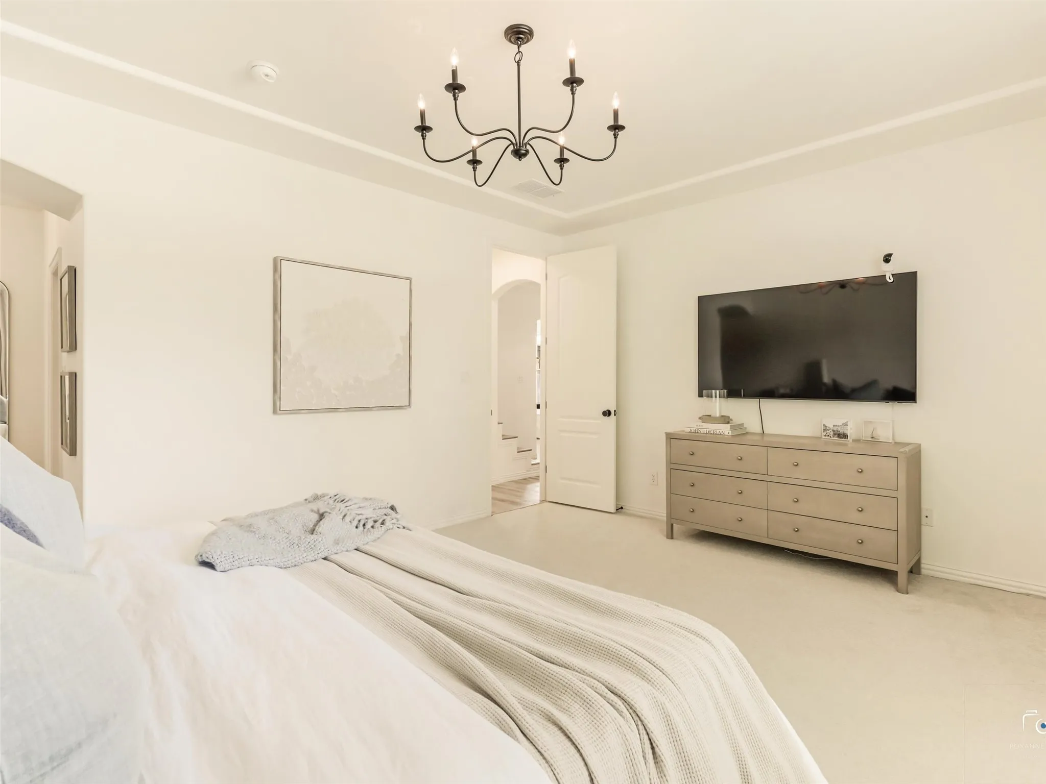 Generously sized owner's retreat offers ample space for large furnishings while maintaining a bright, airy feel. A true sanctuary designed for comfort and relaxation.
