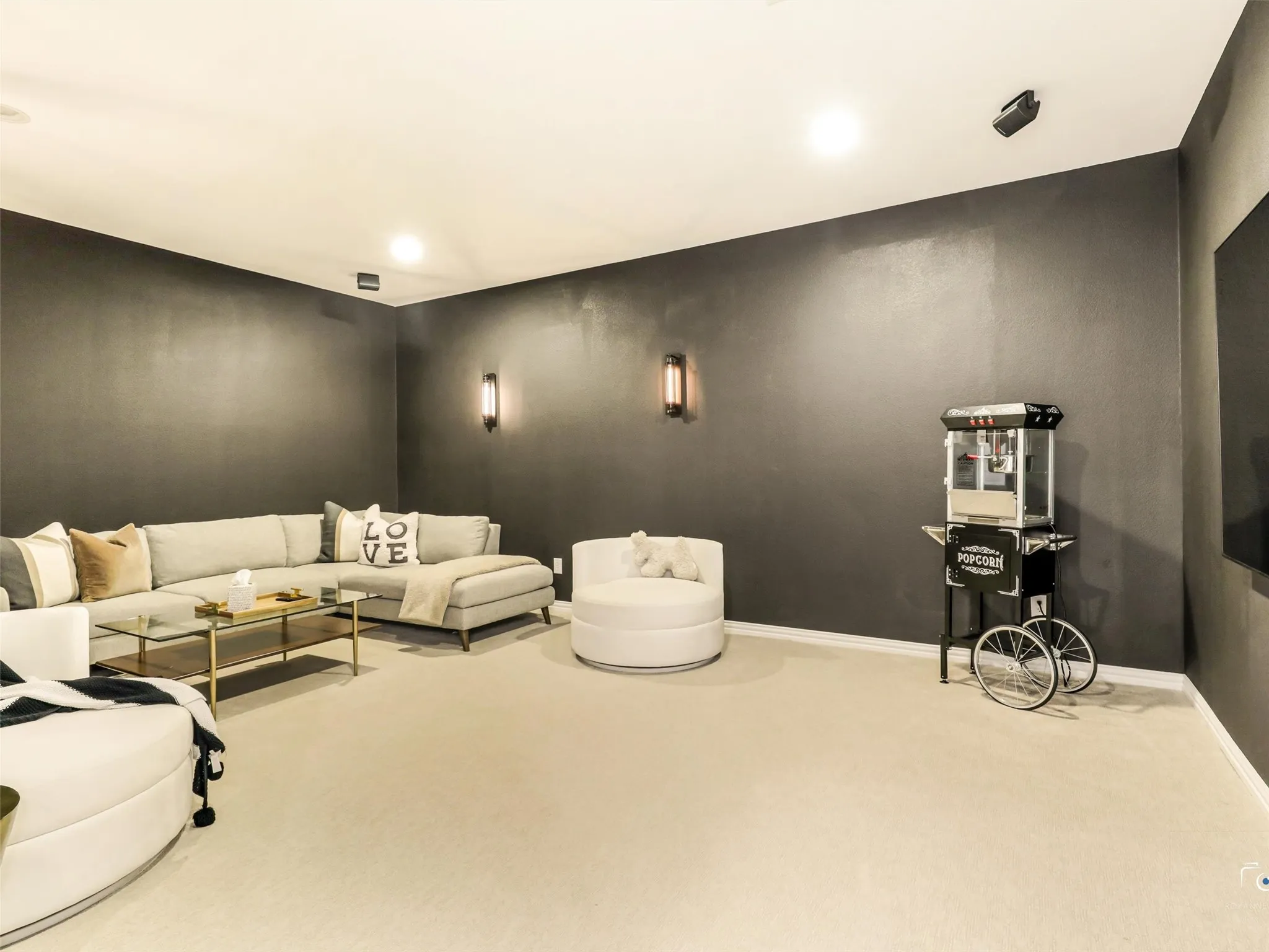 Enjoy cinematic entertainment from the comfort of your own home in this impressive media room designed for family fun and unforgettable gatherings.