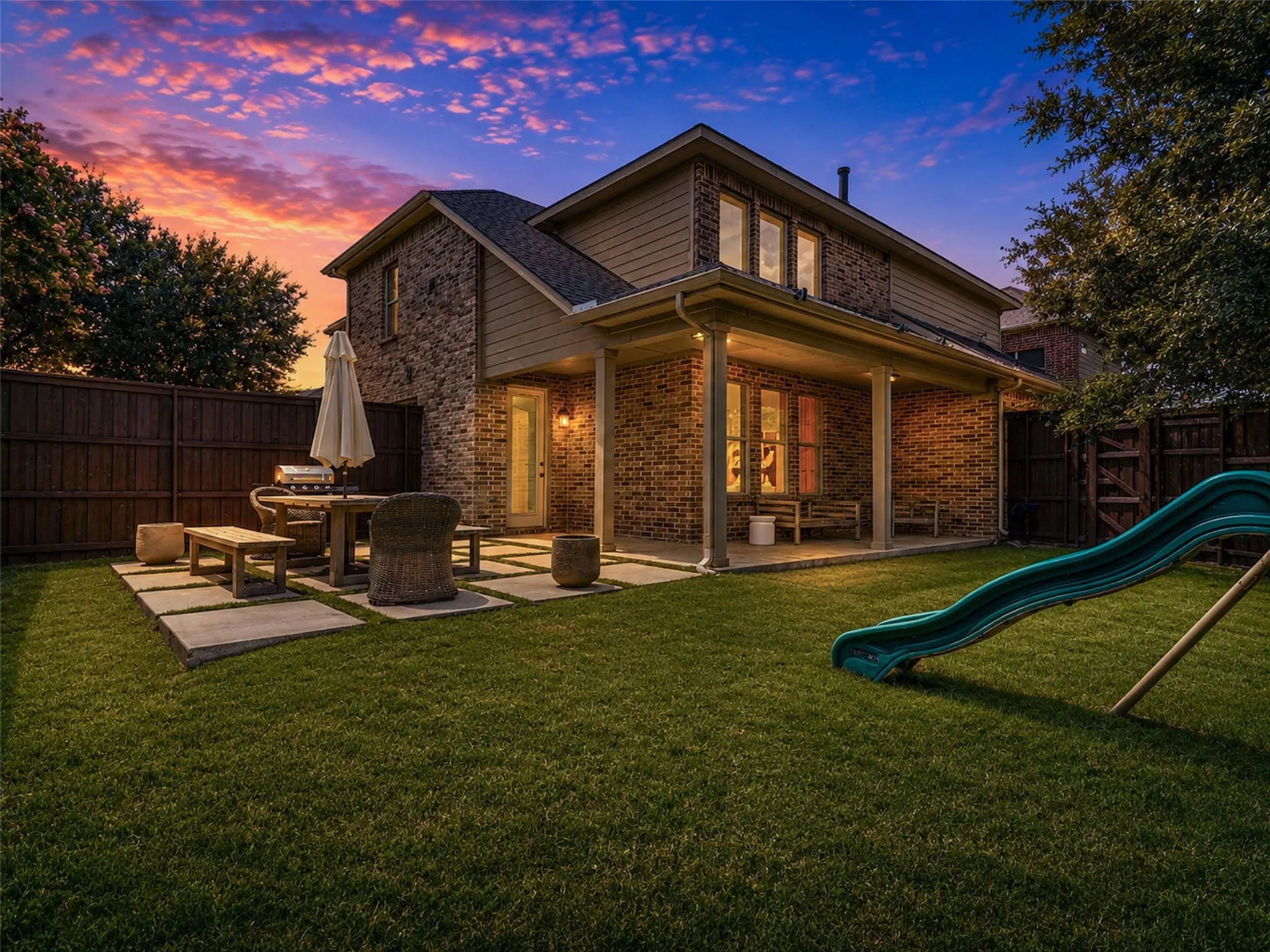 Meticulously maintained exterior showcases great space for summer evenings or quaint quiet mornings.