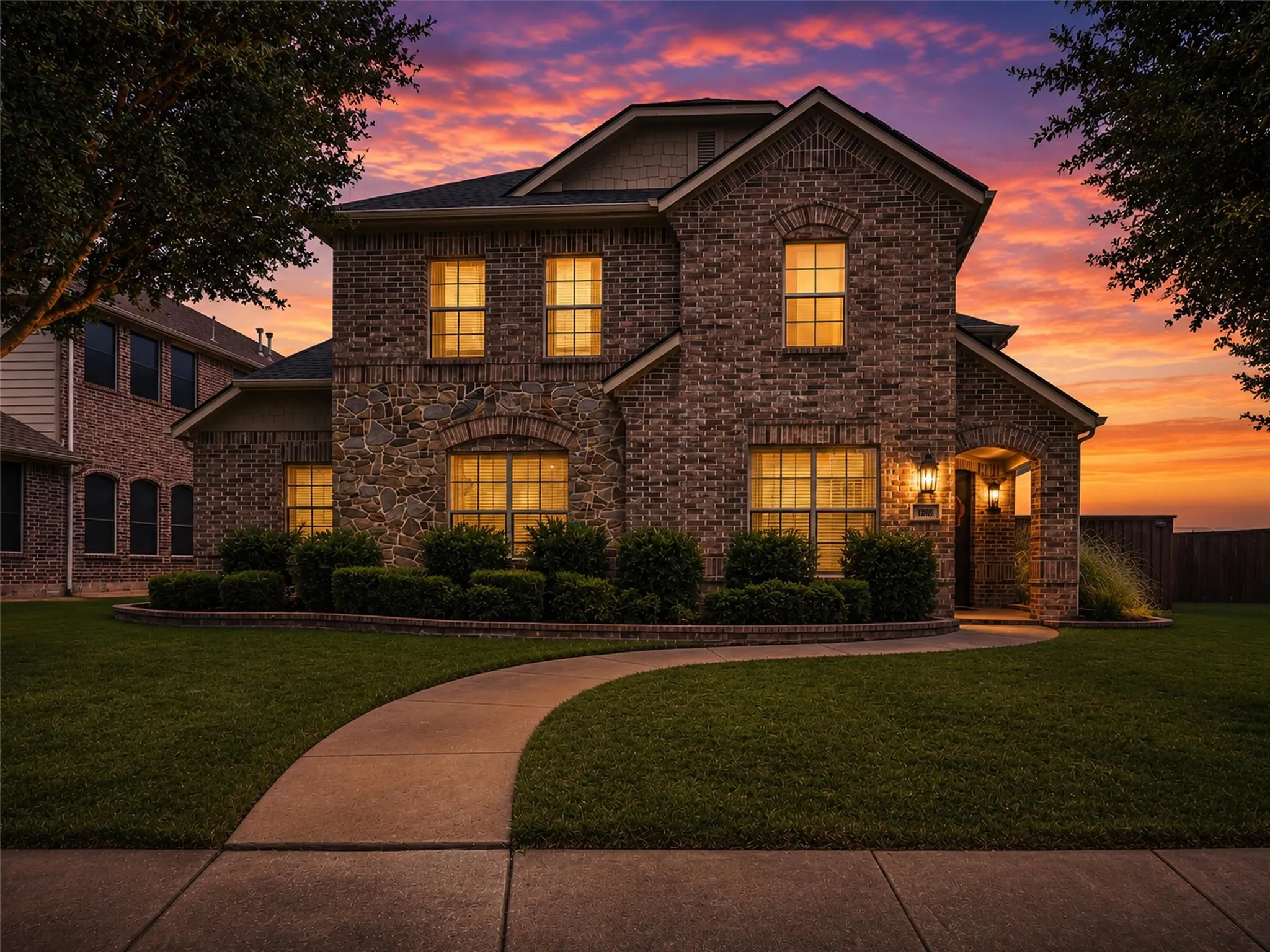  Welcome home to this home with a beautifully updated brick and stone elevation, exceptional curb appeal, mature landscaping, and inviting covered front porch.