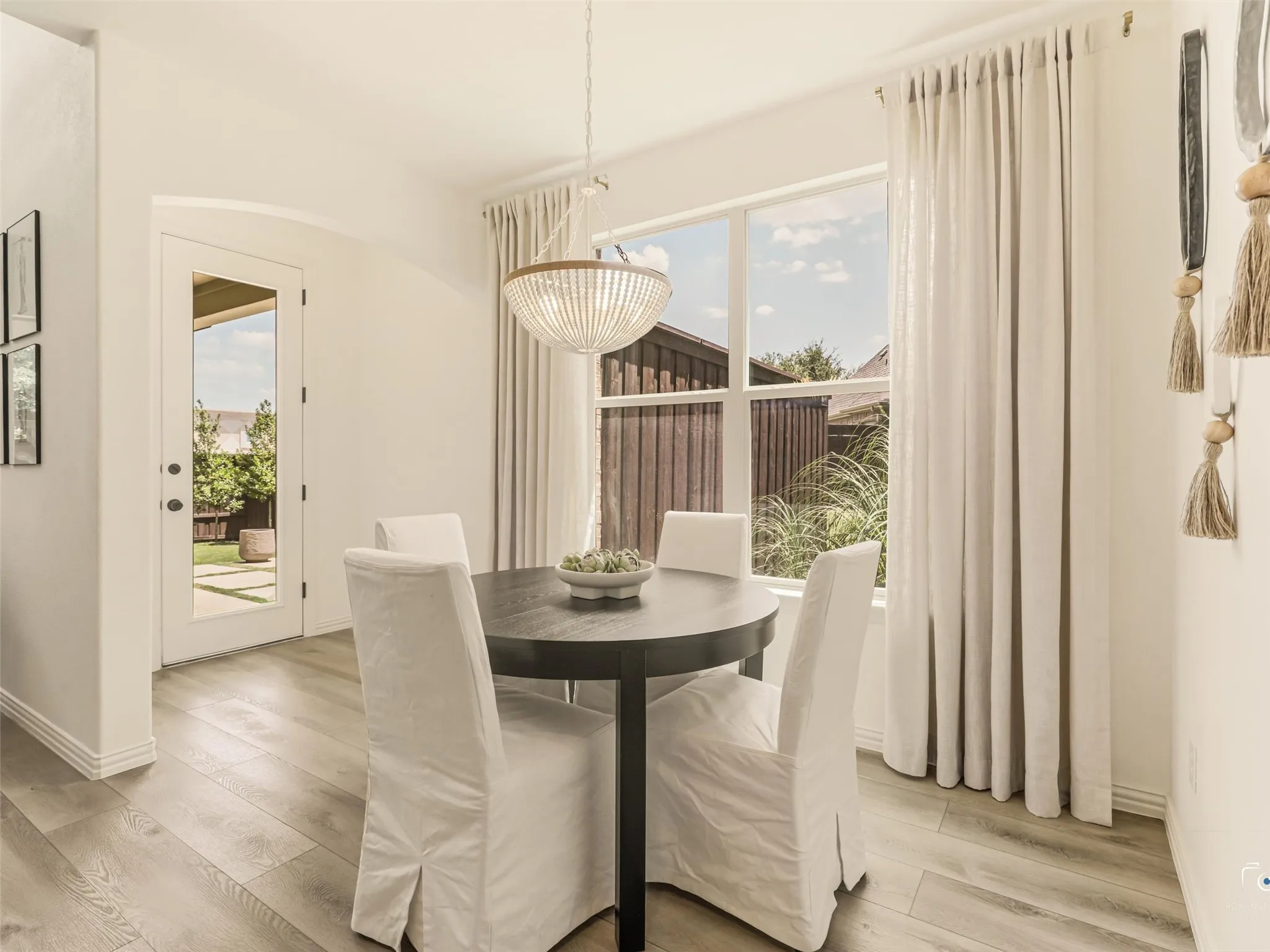 Dining area overlooks the backyard and offers direct access to the covered patio.
