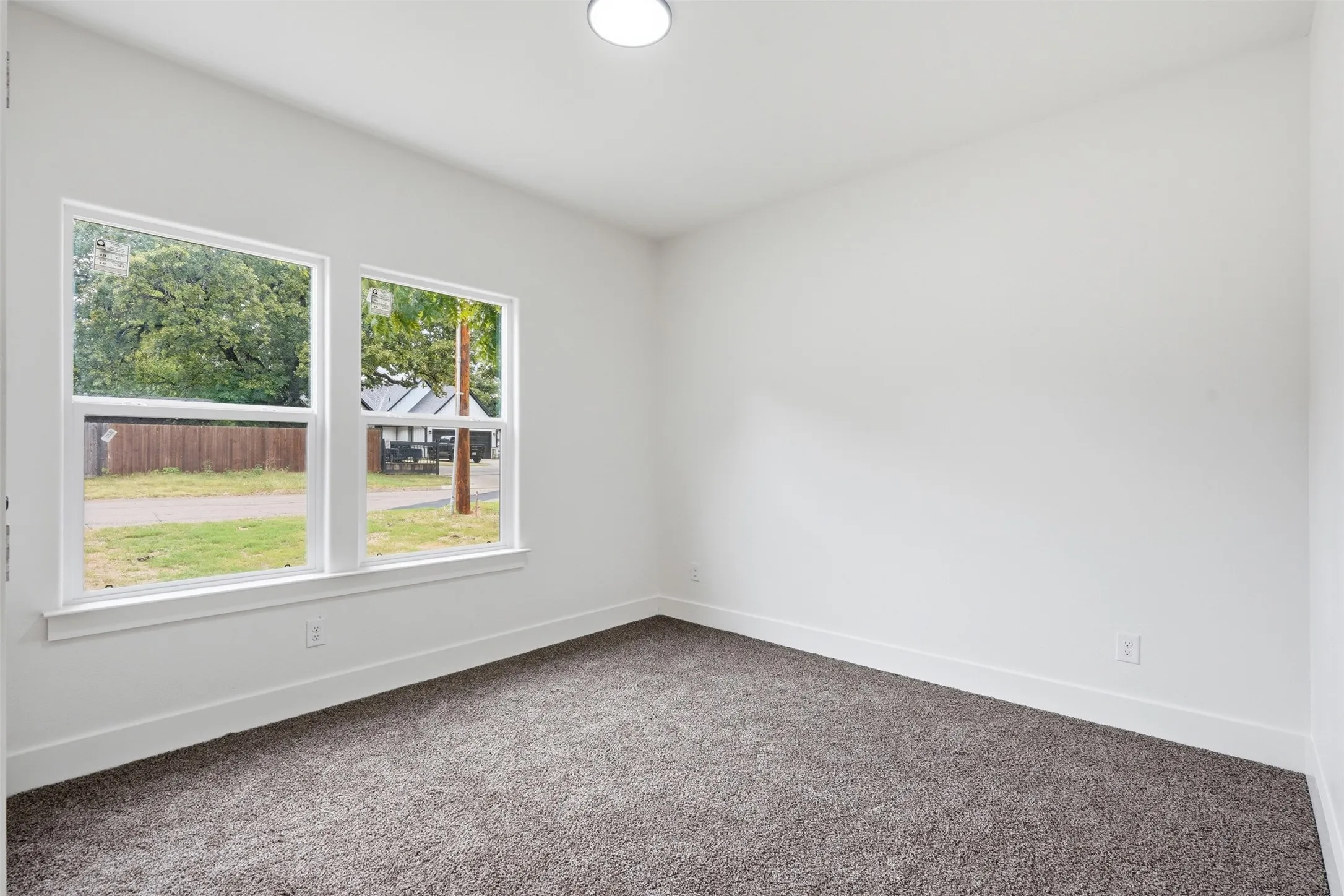 Room featuring neutral gray carpeting and white walls