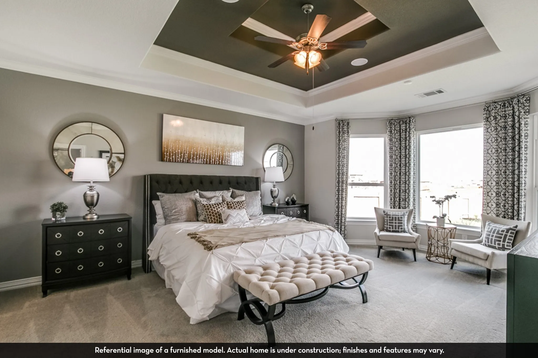 Tray ceiling with contrasting dark paint, crown molding, ceiling fan, and recessed lighting