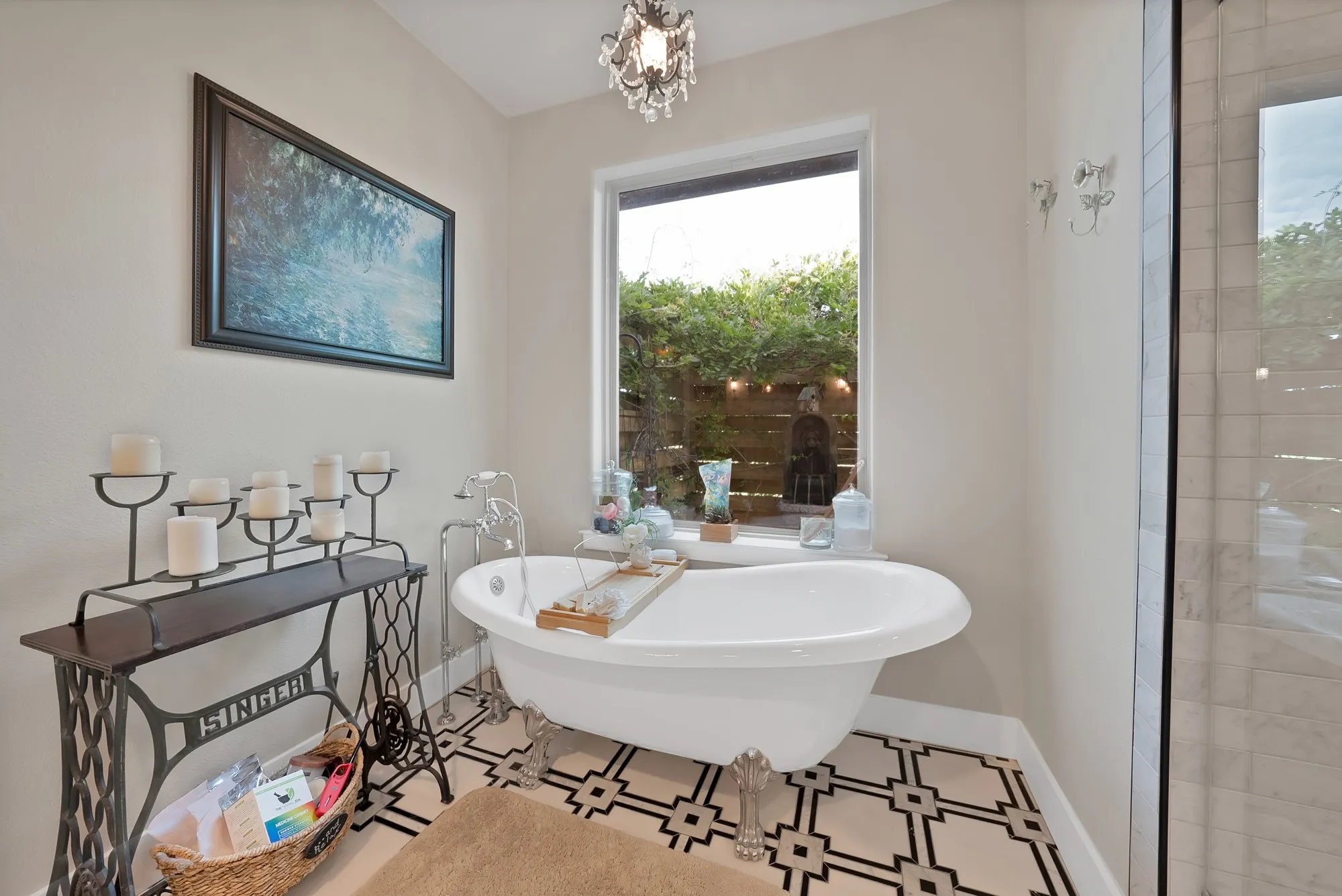 Freestanding tub featuring polished chrome fixtures, set against a geometric pattern tile floor