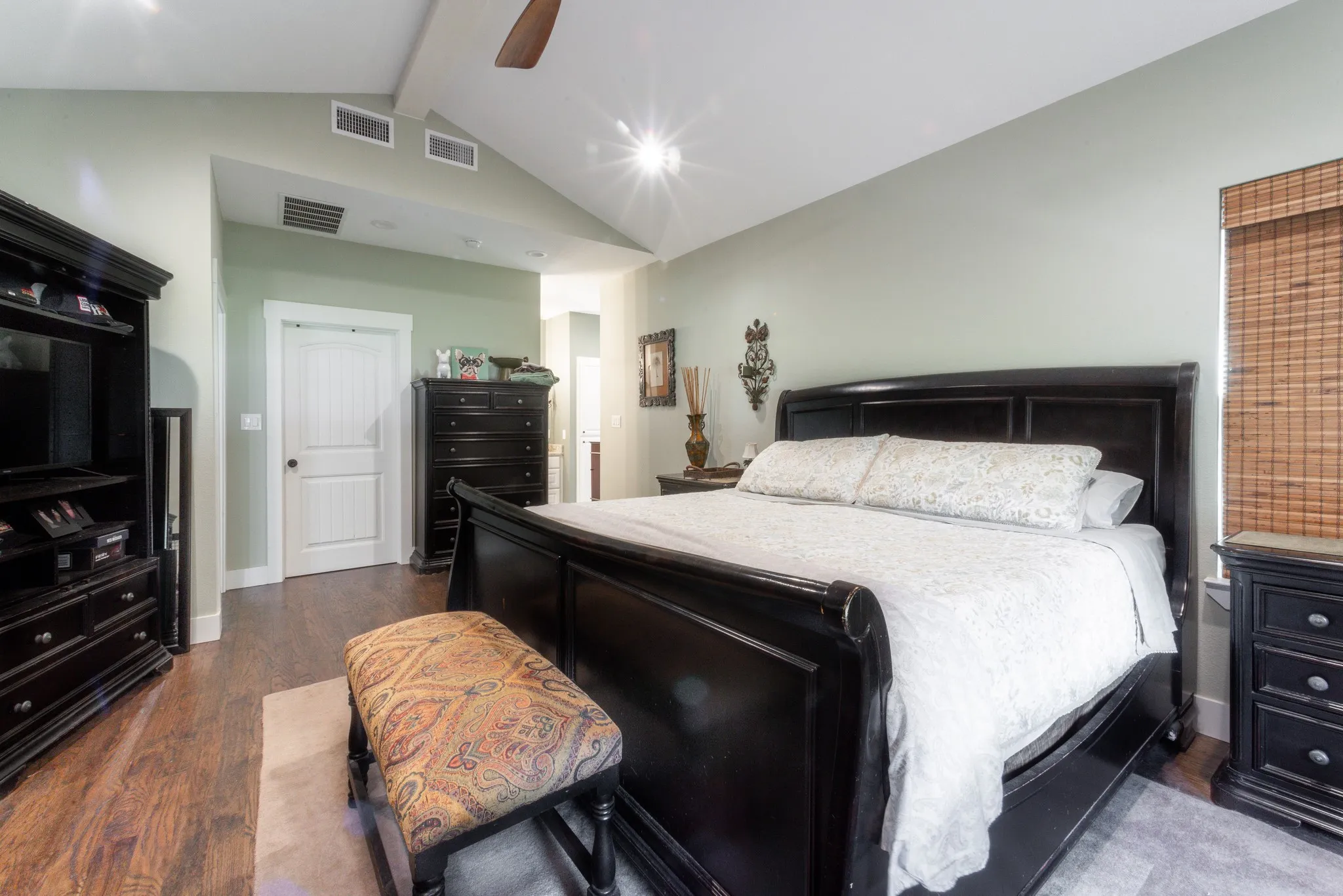 Vaulted ceiling with a ceiling fan and recessed lighting