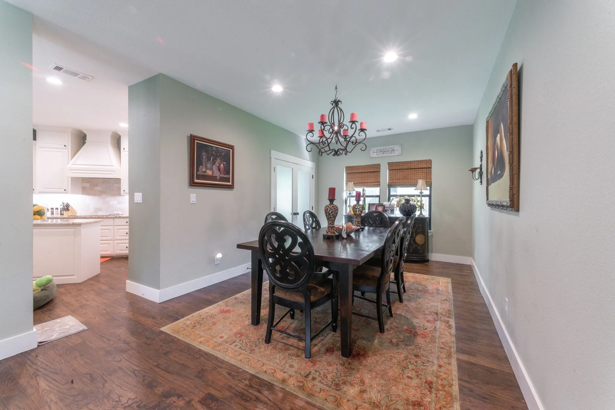 Dining area featuring wood-finish flooring and recessed lighting