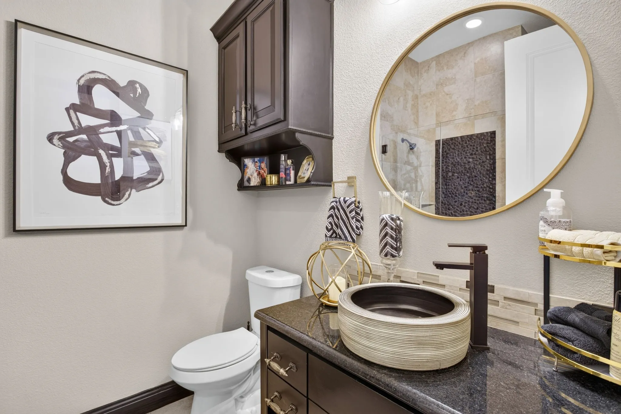 2nd Bathroom has Vanity with a vessel sink, dark stone countertop, and matte black faucet