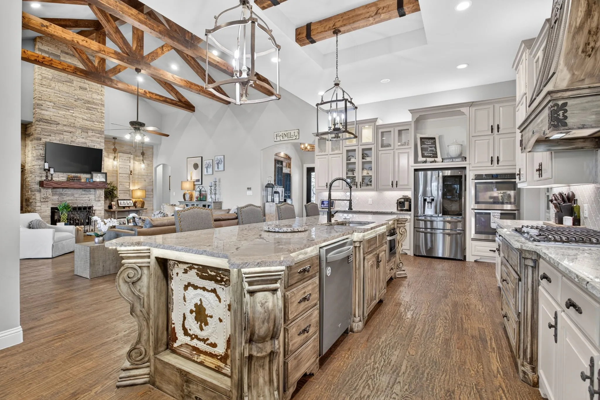 Expansive kitchen island with decorative corbels and a built-in dishwasher